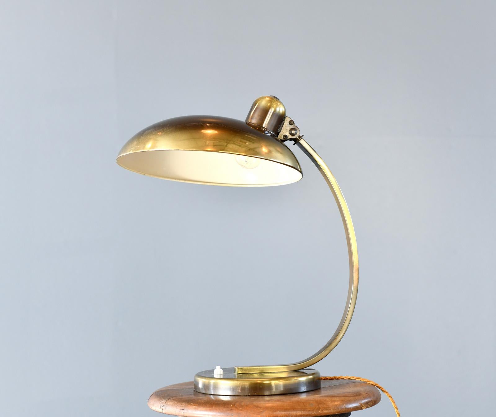 Bauhaus Table Lamp By Kaiser Idell Model 6750 Circa 1930s

- Brass shade, arm and base
- Takes E27 fitting bulbs
- On/Off switch on the base
- German ~ 1930s
- 36cm wide x 46cm tall x 26cm deep

Christian Dell

Dell was born in Offenbach am Main in