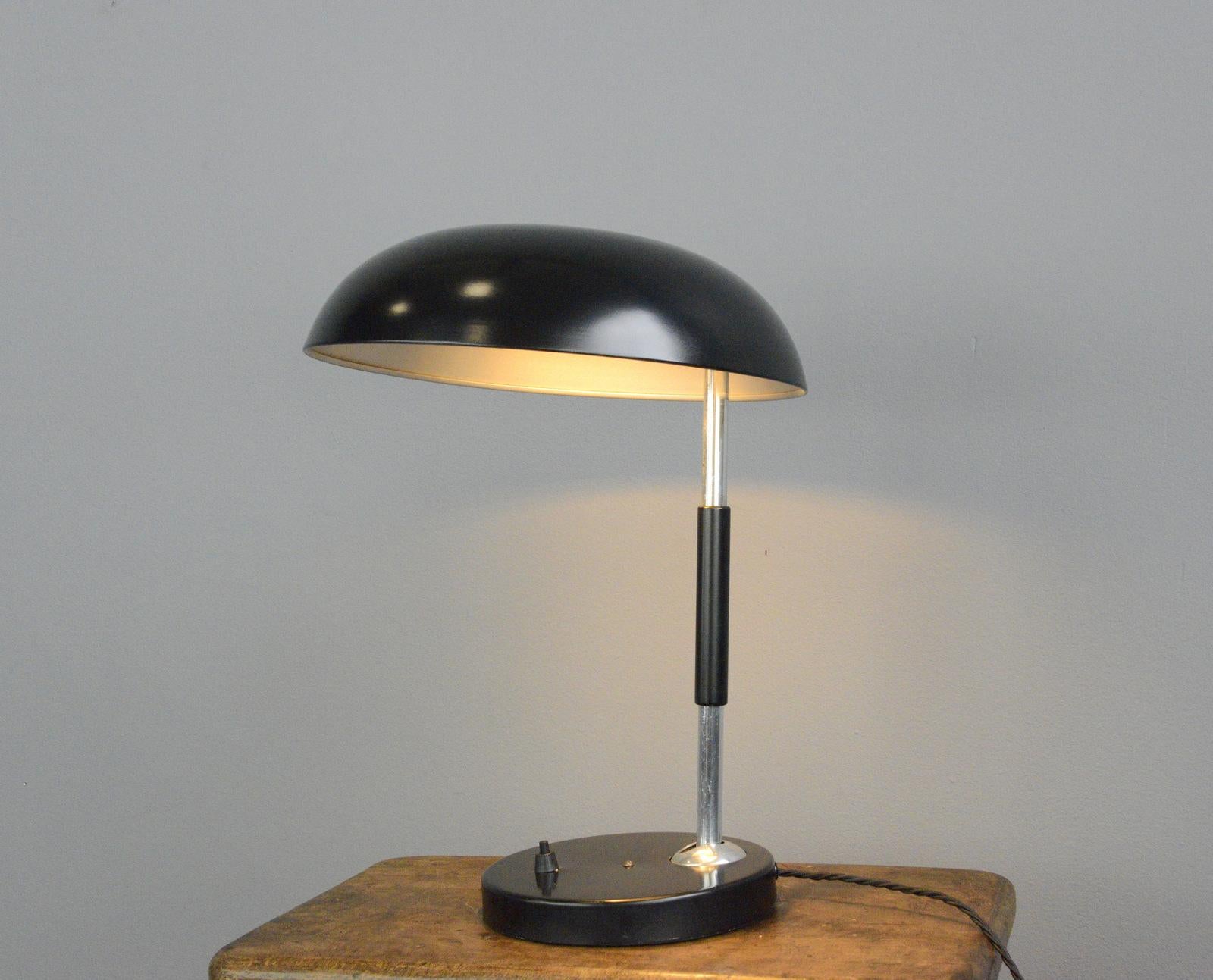 Bauhaus table lamp by Karl Trabert for Bunte & Remmler

- Steel shade and base
- Wooden arm
- Adjustable shade and arm
- On/Off switch on the base
- Designed by Karl Trabert
- Produced by Bunte & Remmler, Frankfurt
- German, 1930s
-