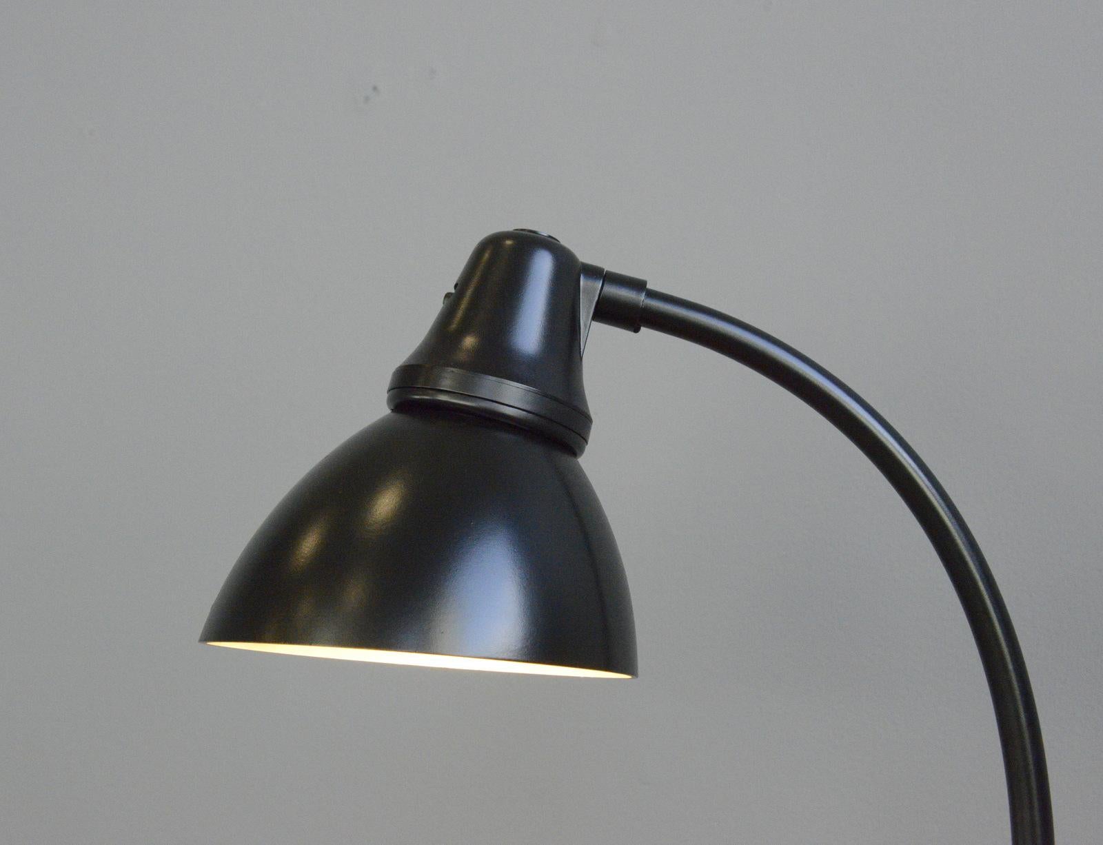 Bauhaus table lamp by Peter Behrens for AEG, circa 1920s

- Curved steel arm
- Bakelite base and shade
- De bossed 