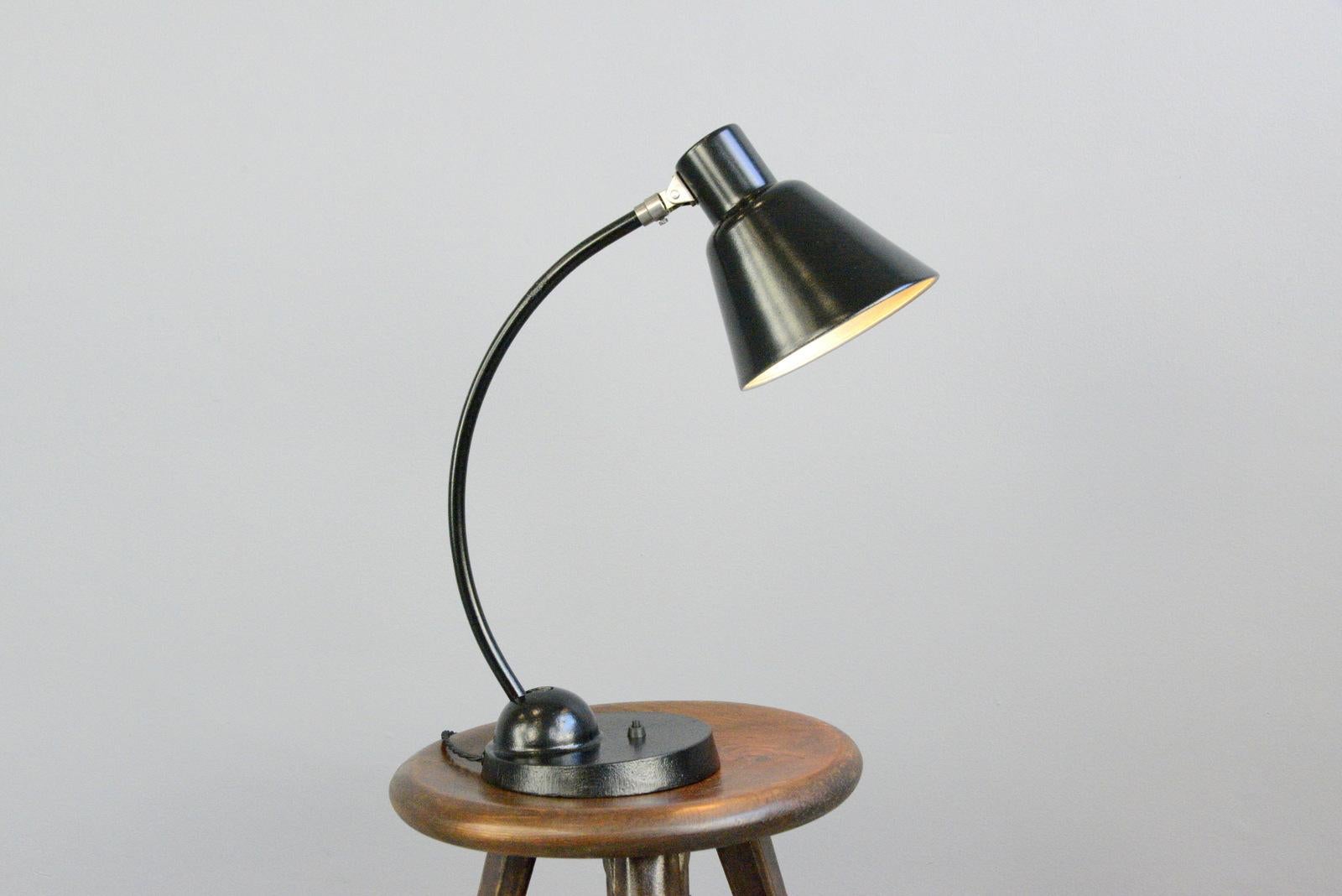 Bauhaus table lamp by Schaco, circa 1930s

- Cast iron base
- Adjustable curved arm
- Adjustable steel shade
- On/Off toggle switch on the base
- Relief 