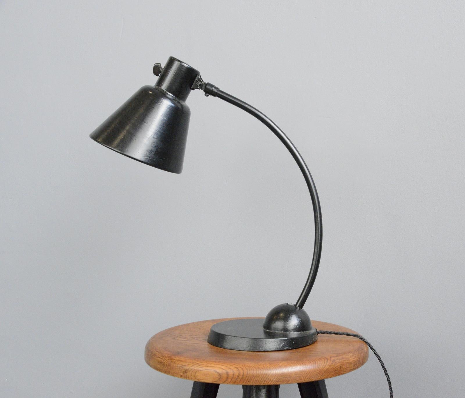 Bauhaus table lamp by Schaco, circa 1930s

- Cast iron base
- Adjustable curved arm
- Adjustable steel shade
- On/Off toggle switch on the shade
- Relief 
