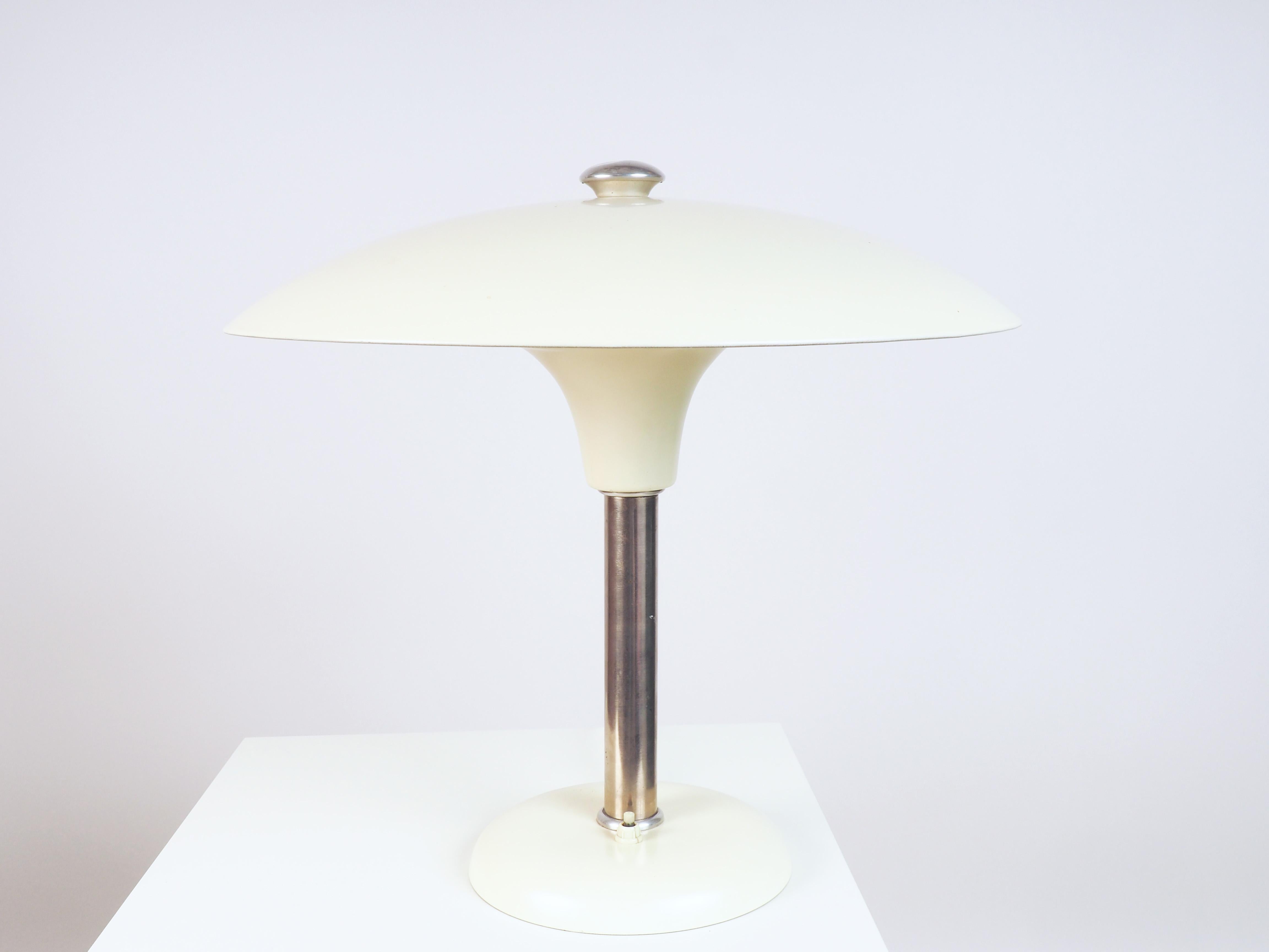 Rare Bauhaus table lamp designed by Max Schumacher and produced by Werner Schroeder, Lobenstein, Germany.
Marked underneath MSW.