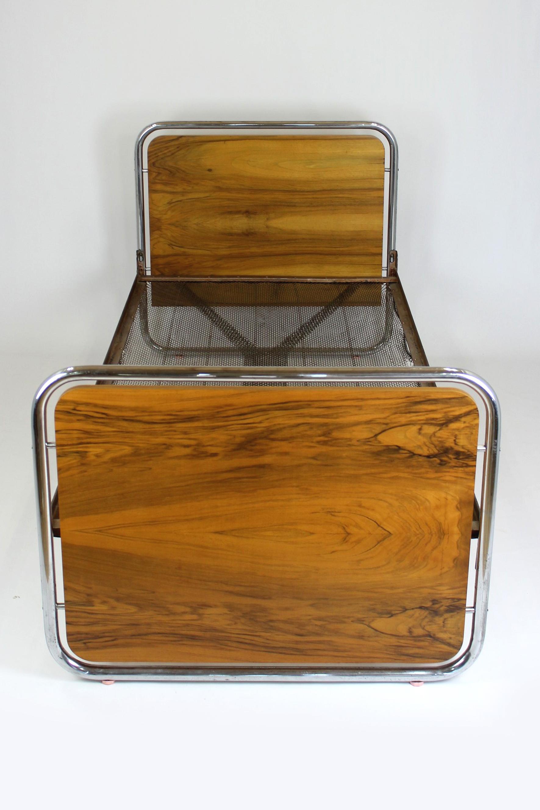 This Bauhaus-style beds were produced in the 1940s in Czechoslovakia. They are made of walnut and set on chromed tubular steel frames.
The beds have been partially restored, the wood is lacquered in a satin finish. Chrome elements are preserved in