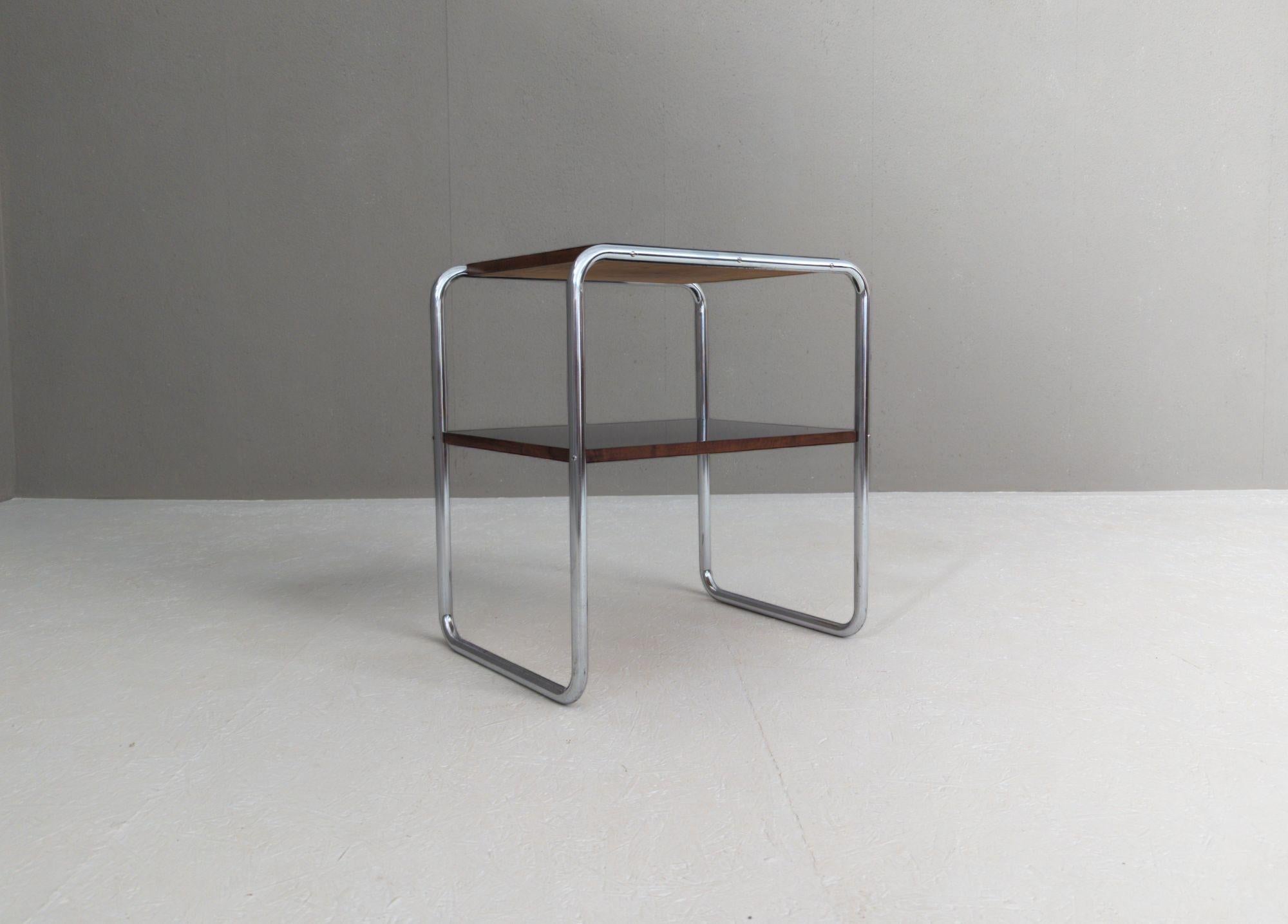 Originally designed by Marcel Breuer and catalogued as model B 12, this elegant Bauhaus side table stands as a hallmark of rational design. Manufactured in the 1930s by Mücke & Melder under license from Thonet, this Czechoslovak production reflects