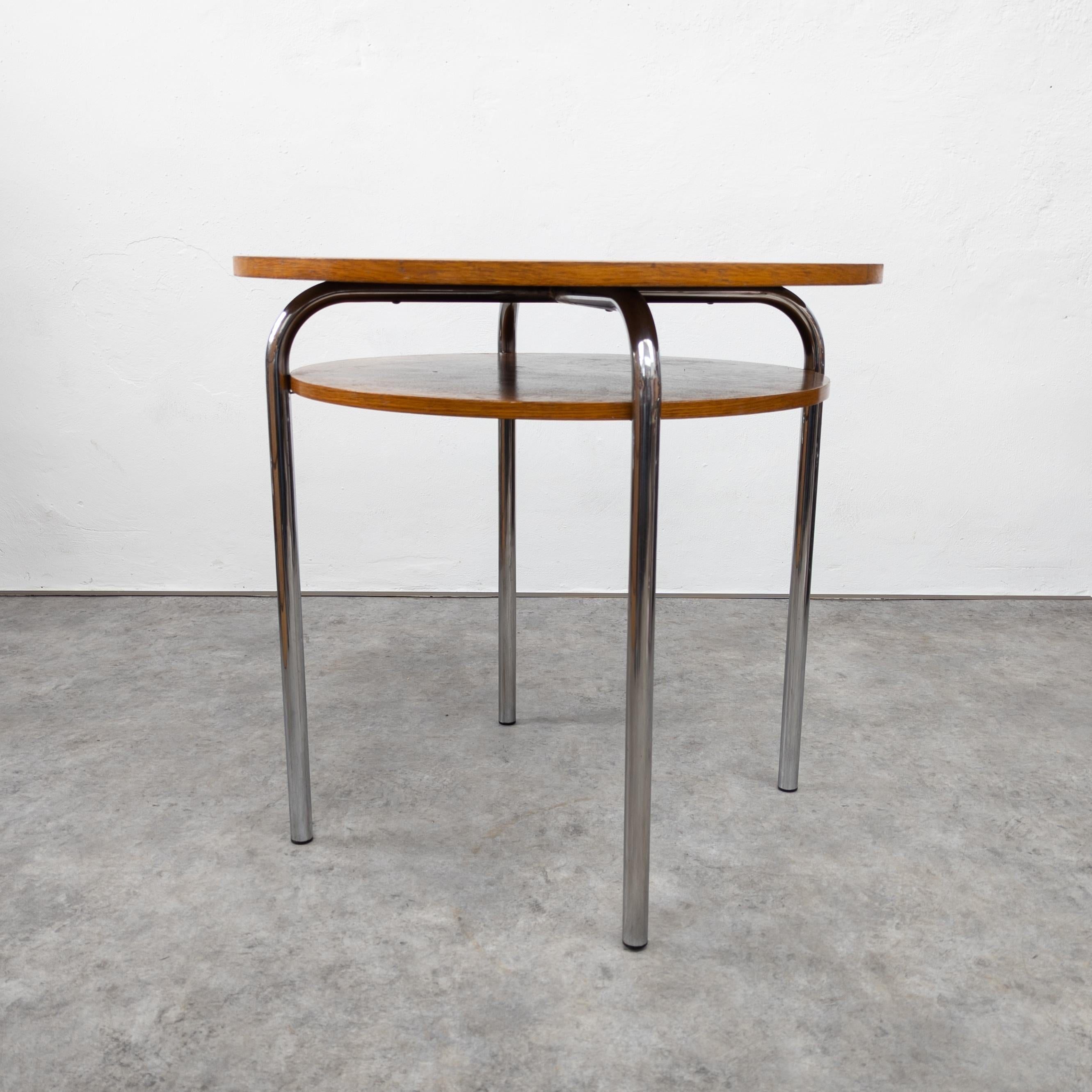 Variation of Ludwig Mies van der Rohe Thonet MR515 table. Manufactured by Vichr and Co., former Czechoslovakia in 1930s. In good original condition with some traces of wear and age on the wooden top, chrome very well preserved. Height 77 cm,