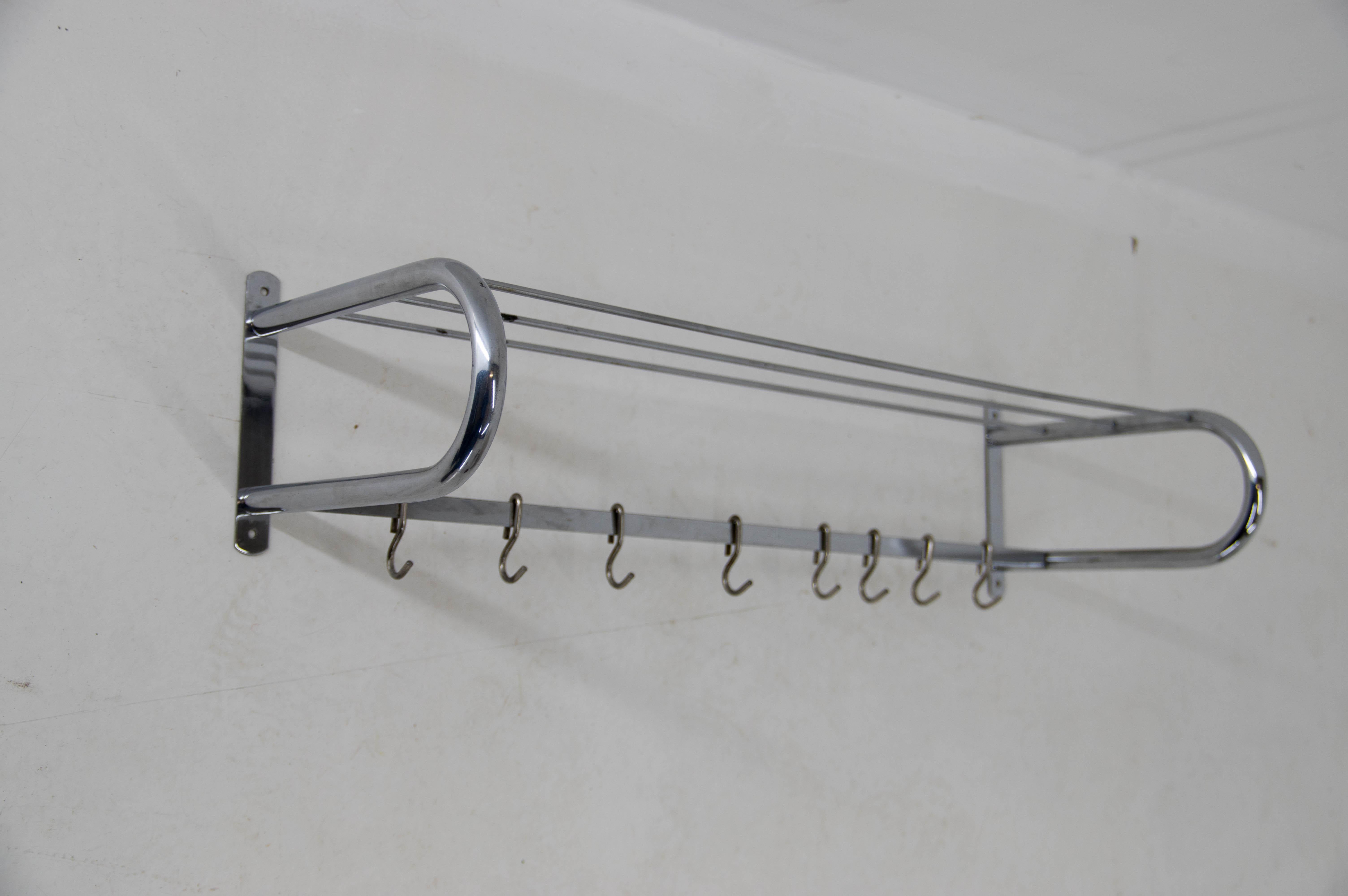 Bauhaus wall coat hanger with 8 hooks.
Chrome with minor age patina.