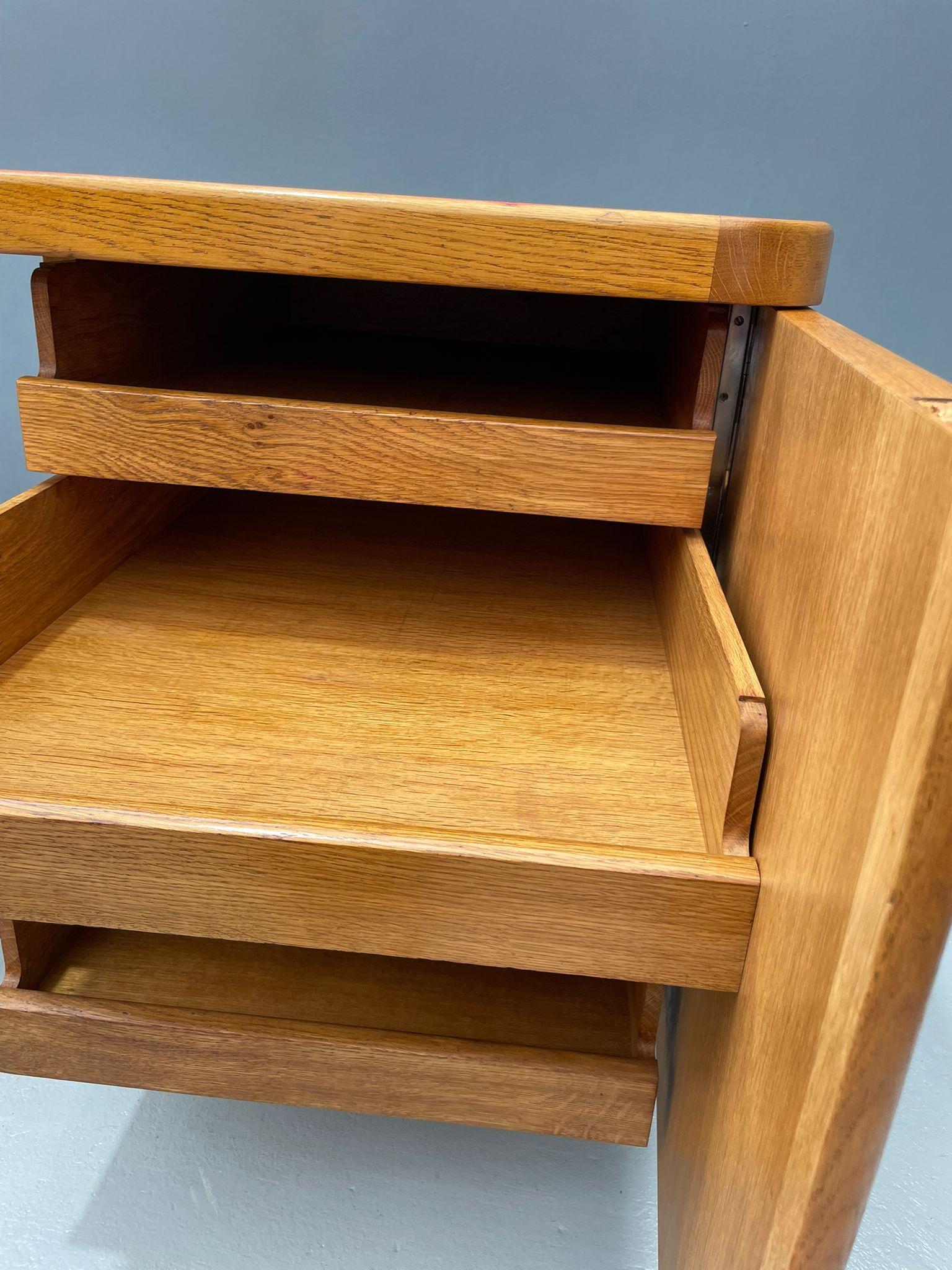 For sale is a beautiful vintage Bauhaus-style writing desk that blends mid-century elegance with practical design. The red Formica top gives it a striking look and is easy to maintain. Crafted from walnut wood and plywood, the desk features its