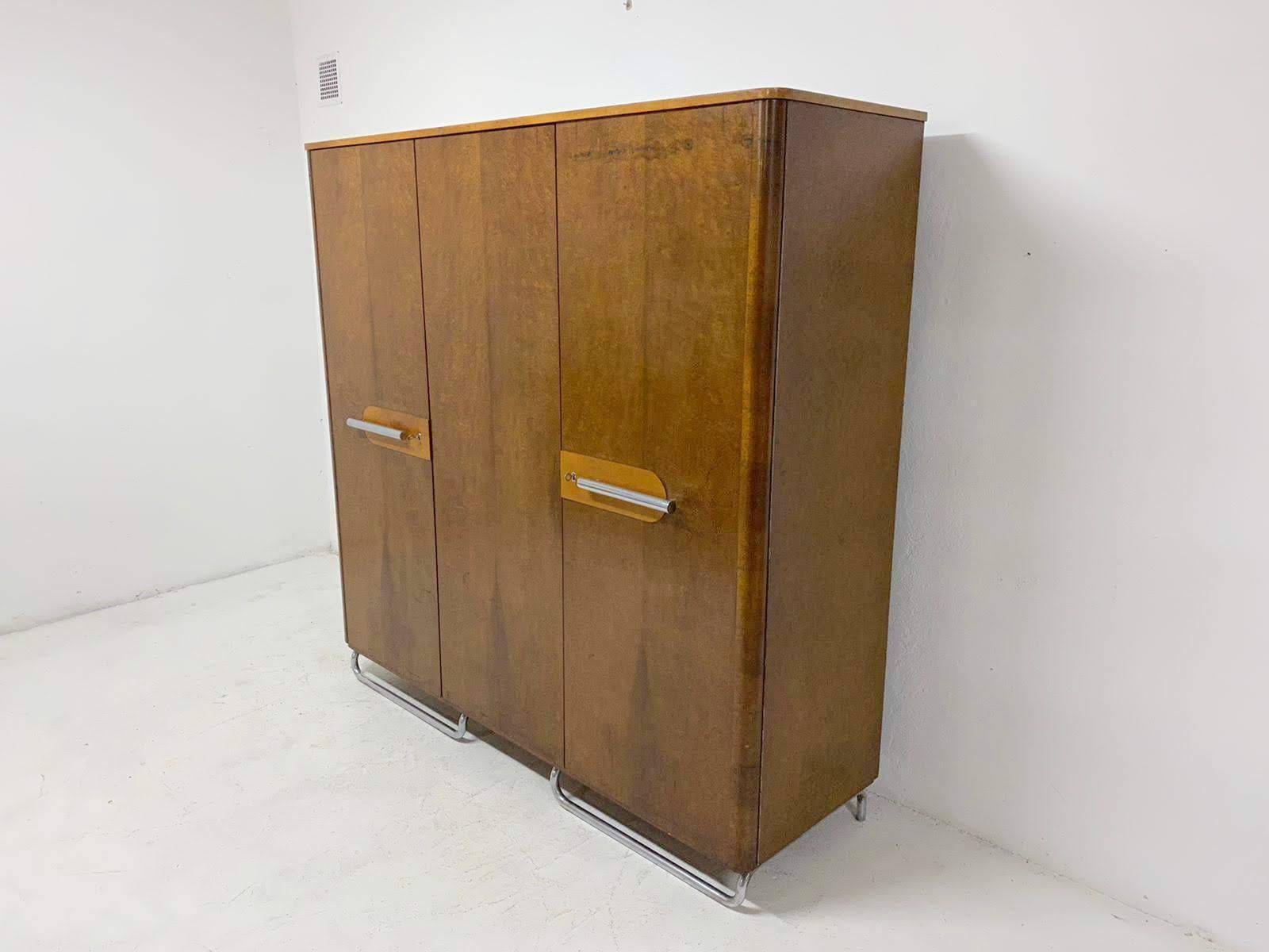 Functionalist wardrobe with chrome elements from the Bauhaus period. It was made in the former Czechoslovakia by Mücke & Melder company in the 1930s.
This is a typical example of residential furniture from the Bauhaus period in Central Europe.