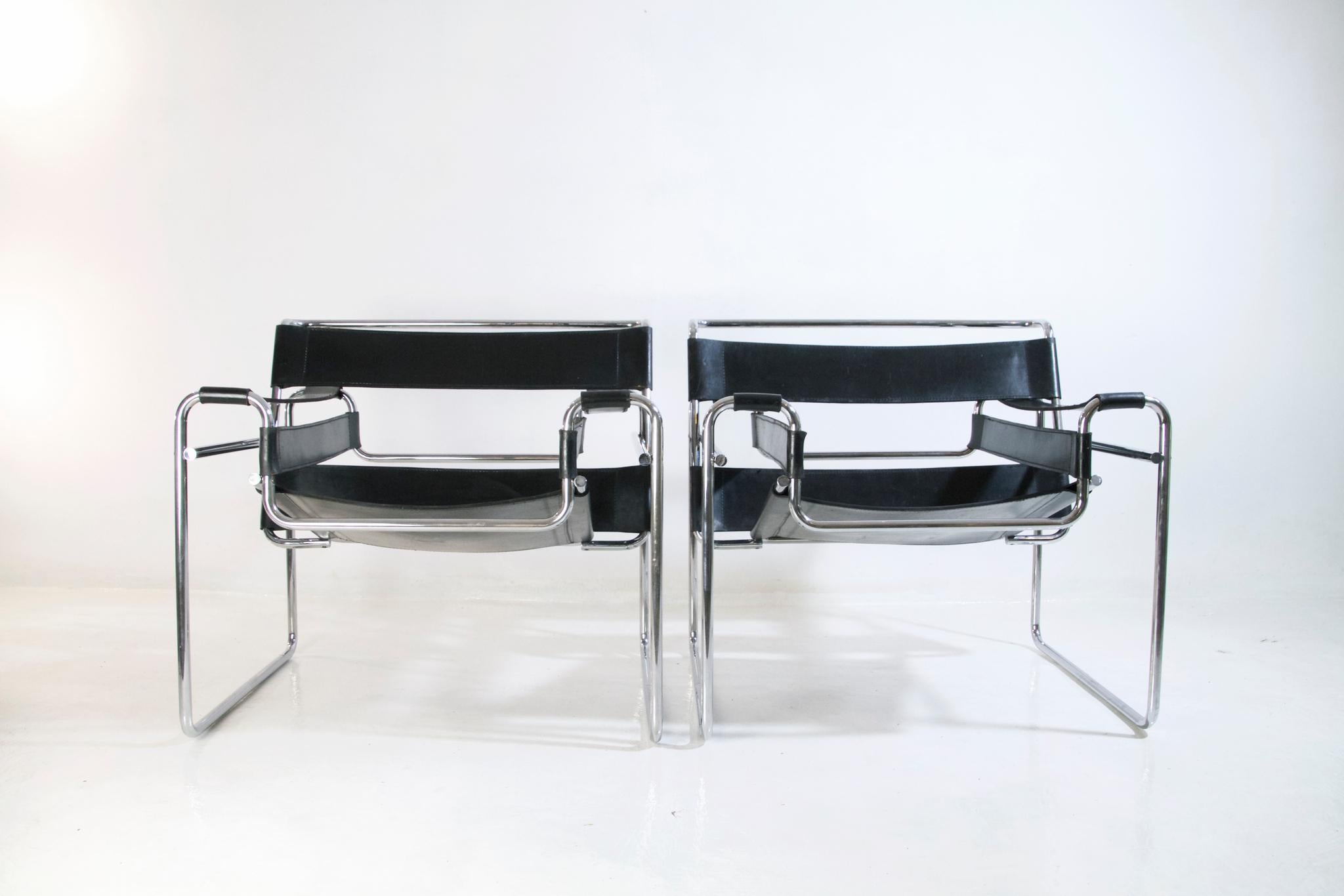 A pair of Wassily chairs, also known as the B3 Chair, designed by Marcel Breuer in 1925 while he was working at the Bauhaus. These chairs comes from the first original owners who bought them in Rome, Italy in the 1960's. High quality leather which