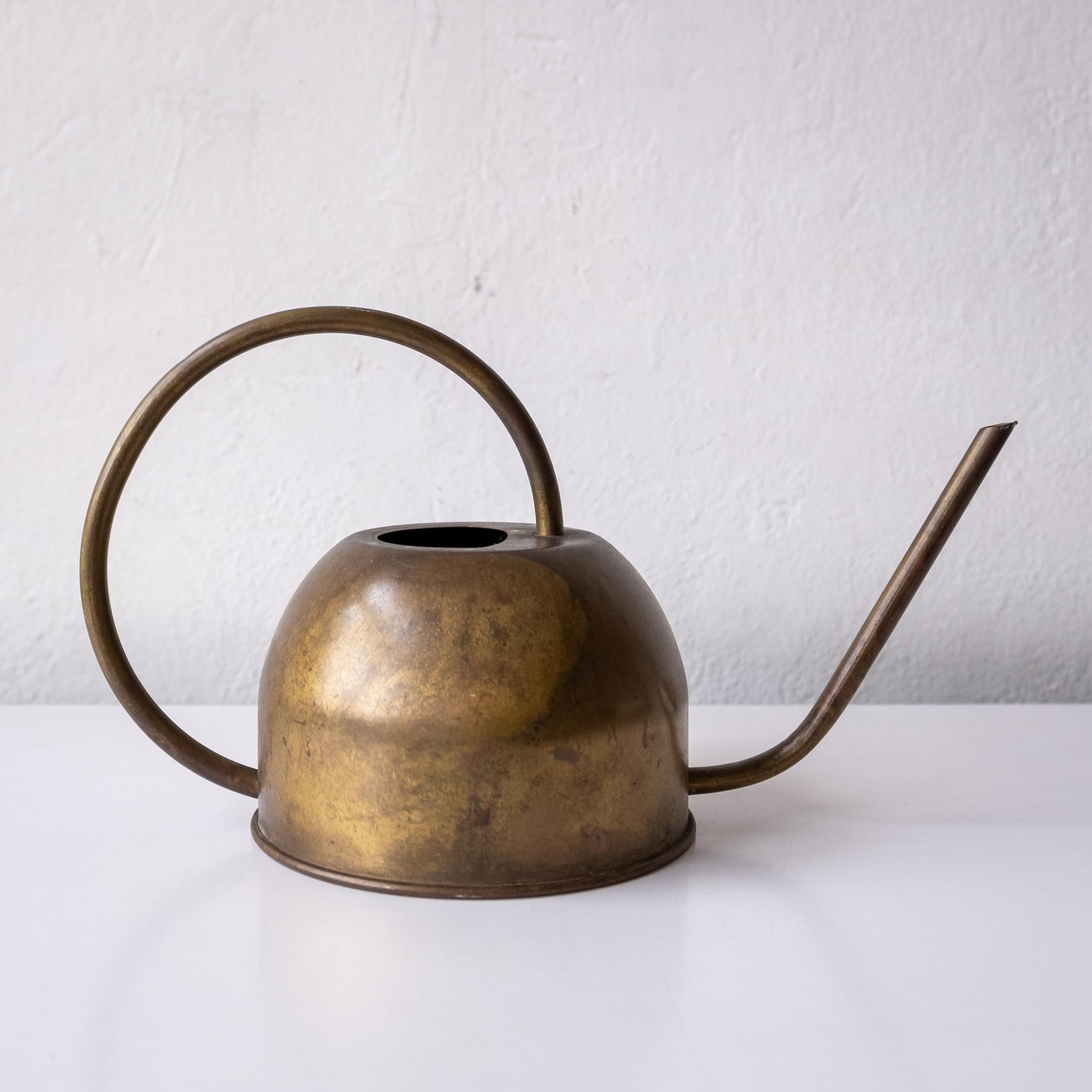 A German watering can. A functional Bauhaus design with a beautiful patina. Retains a partial Made in Germany paper label on the bottom. Water tight and pours nicely.