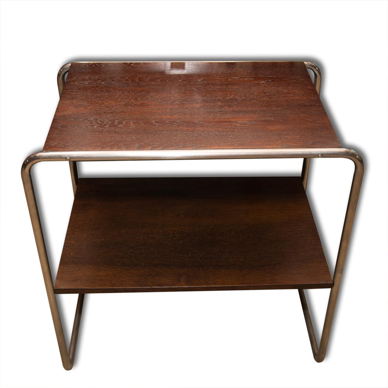 A chromium-plated side table designed by Marcel Breuer, Bauhaus period, 1930s, made in Bohemia. It features a chromium-plated base metal and wooden boards. The table is after refurbish using shellac polish. In excellent condition.

 