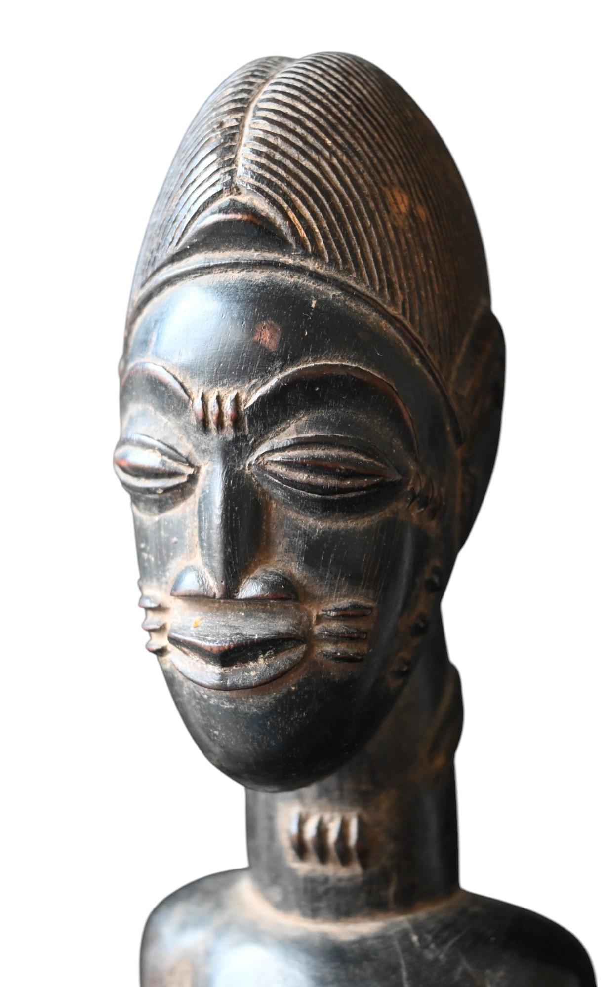 Hand-Carved Baule “Blolo Bian” Statue – Côte d’Ivoire, Early 20th Century For Sale