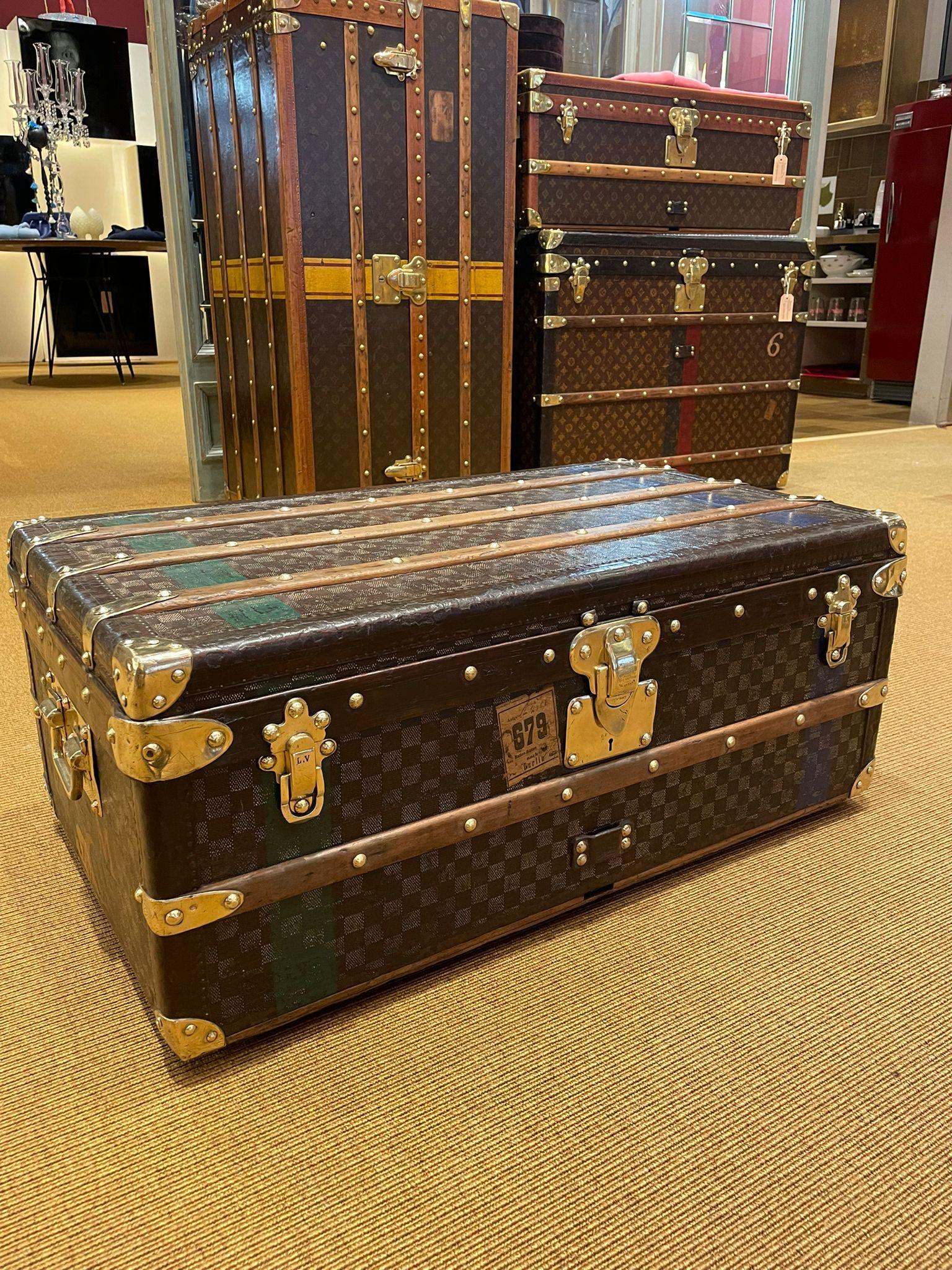 Louis Vuitton's elegant and exclusive Malle Cabine trunk, the Maison's travel icon. The sophisticated creation, with its compact design, was intended to be stowed under the cabin bed of an early 20th century ocean liner. This model that can now be