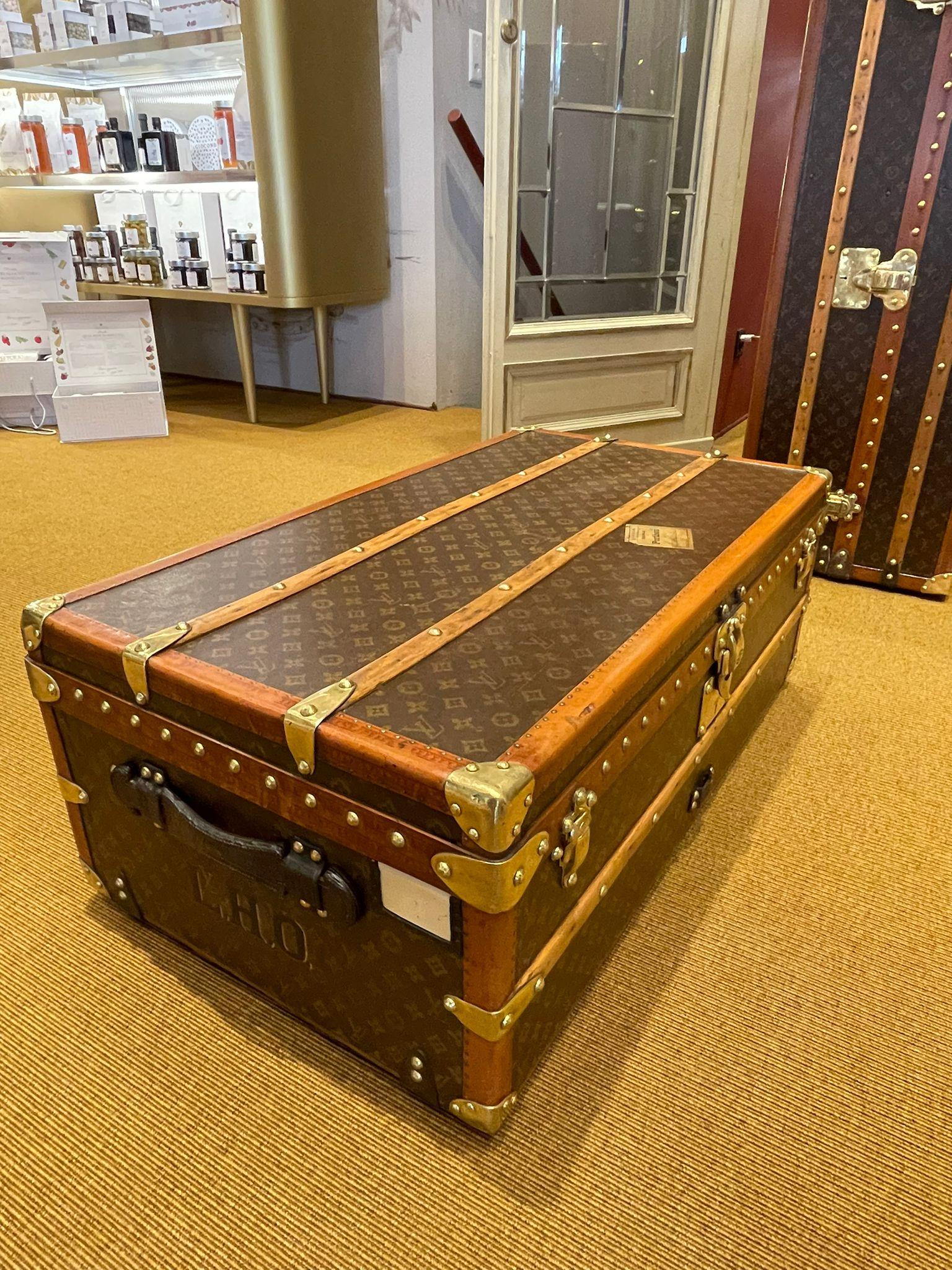 Louis Vuitton's elegant and exclusive Malle Cabine trunk, the Maison's travel icon. The sophisticated creation, with its compact design, was intended to be stowed under the cabin bed of an early 20th century ocean liner. The refined model, equipped