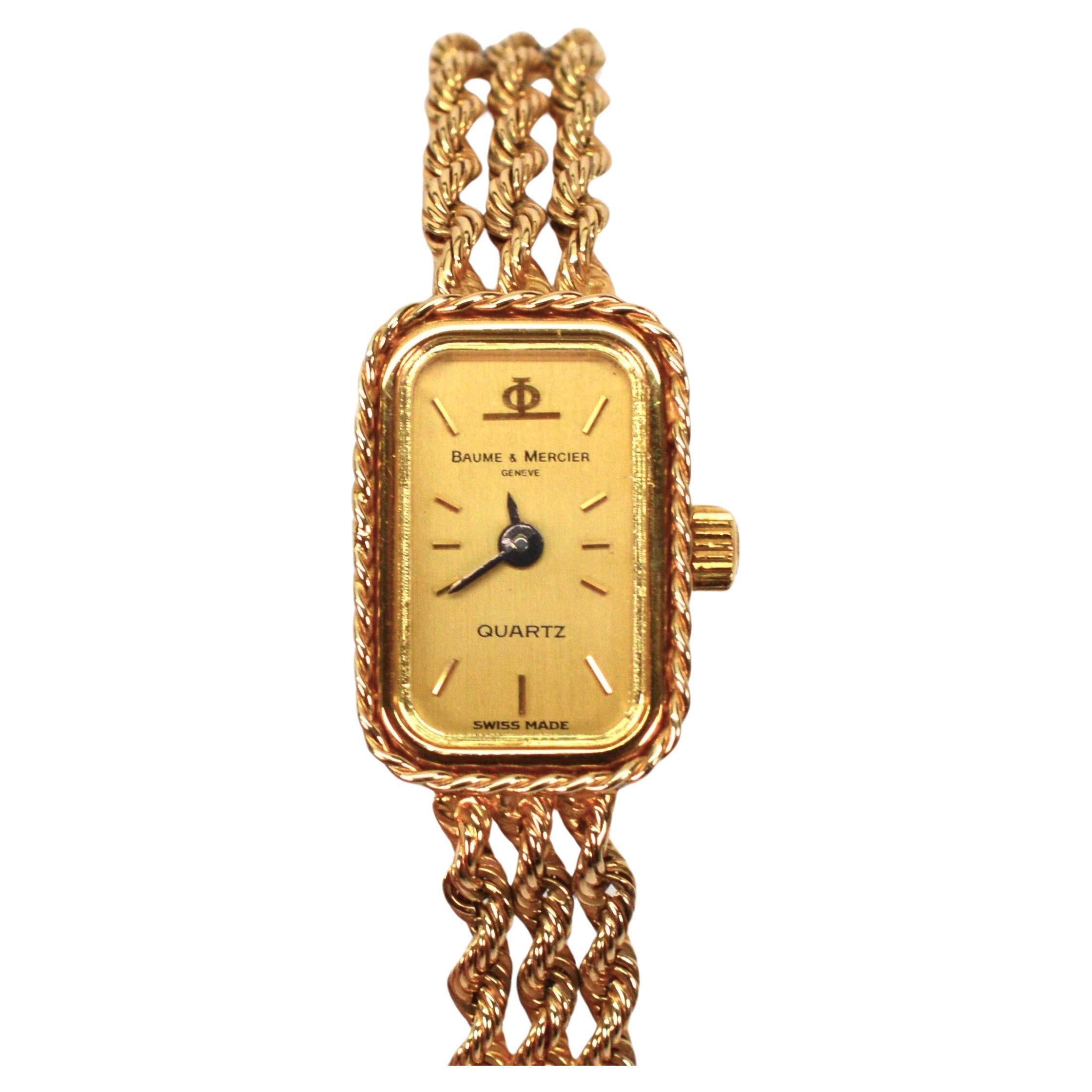 Circa 1960s and the height of vintage fashion by famous maker, Baum and Mercier, this Swiss made quartz dress watch is ultra feminine and truly desirable as dress jewelry and a functioning timepiece. Three congruent strands of elegant 14 karat