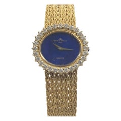 Baum & Mercier Montre-bracelet mécanique pour femme en or jaune avec cadran en lapis et diamants