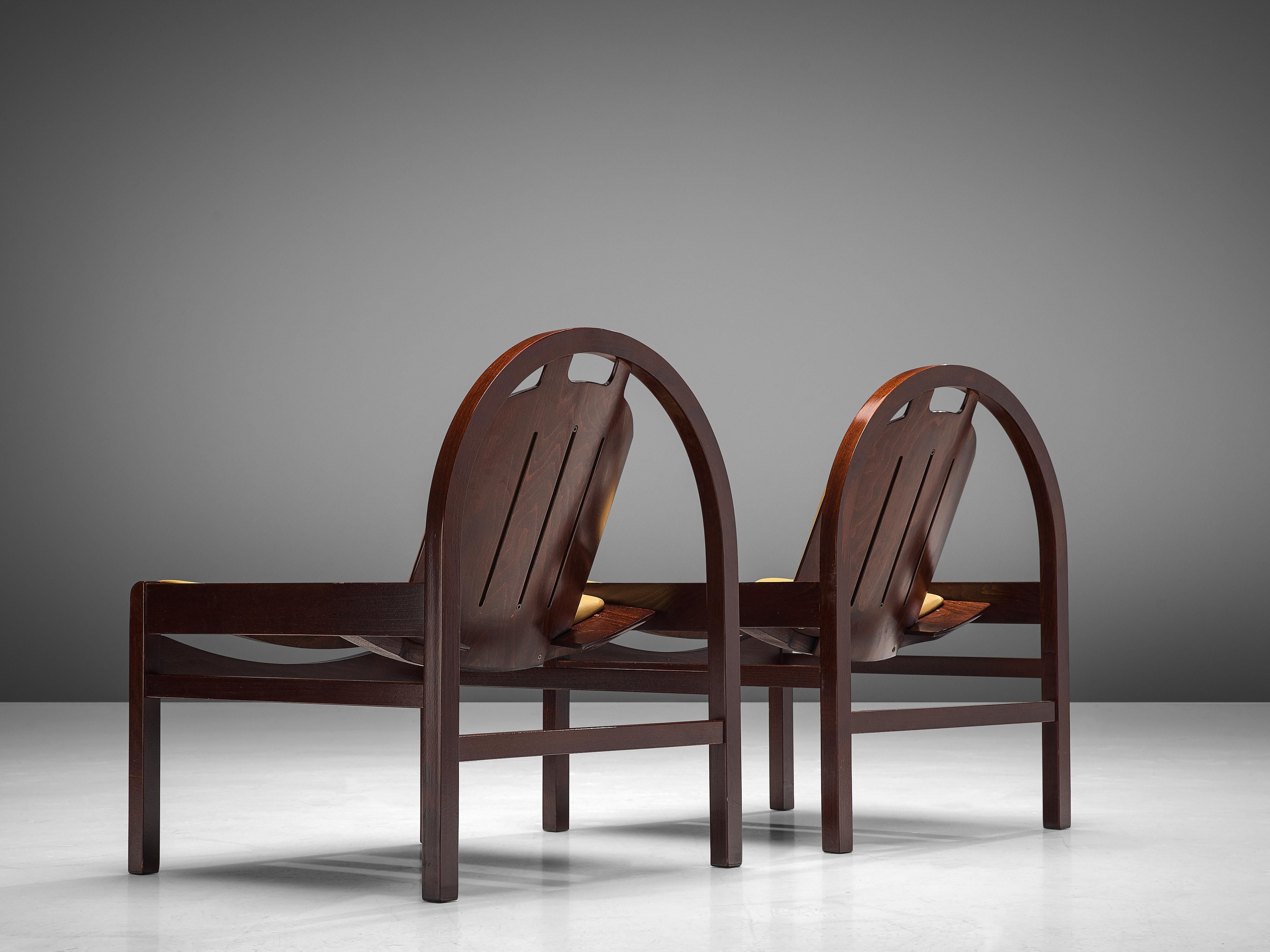 Baumann, 'Argos' easy chairs, stained beech, leather, France, 1970s

These 'Argos' lounge chairs are manufactured by Baumann in France in the 1970s. The chairs feature a round frame that supports the tilted backrest. The tilted seat is wide and