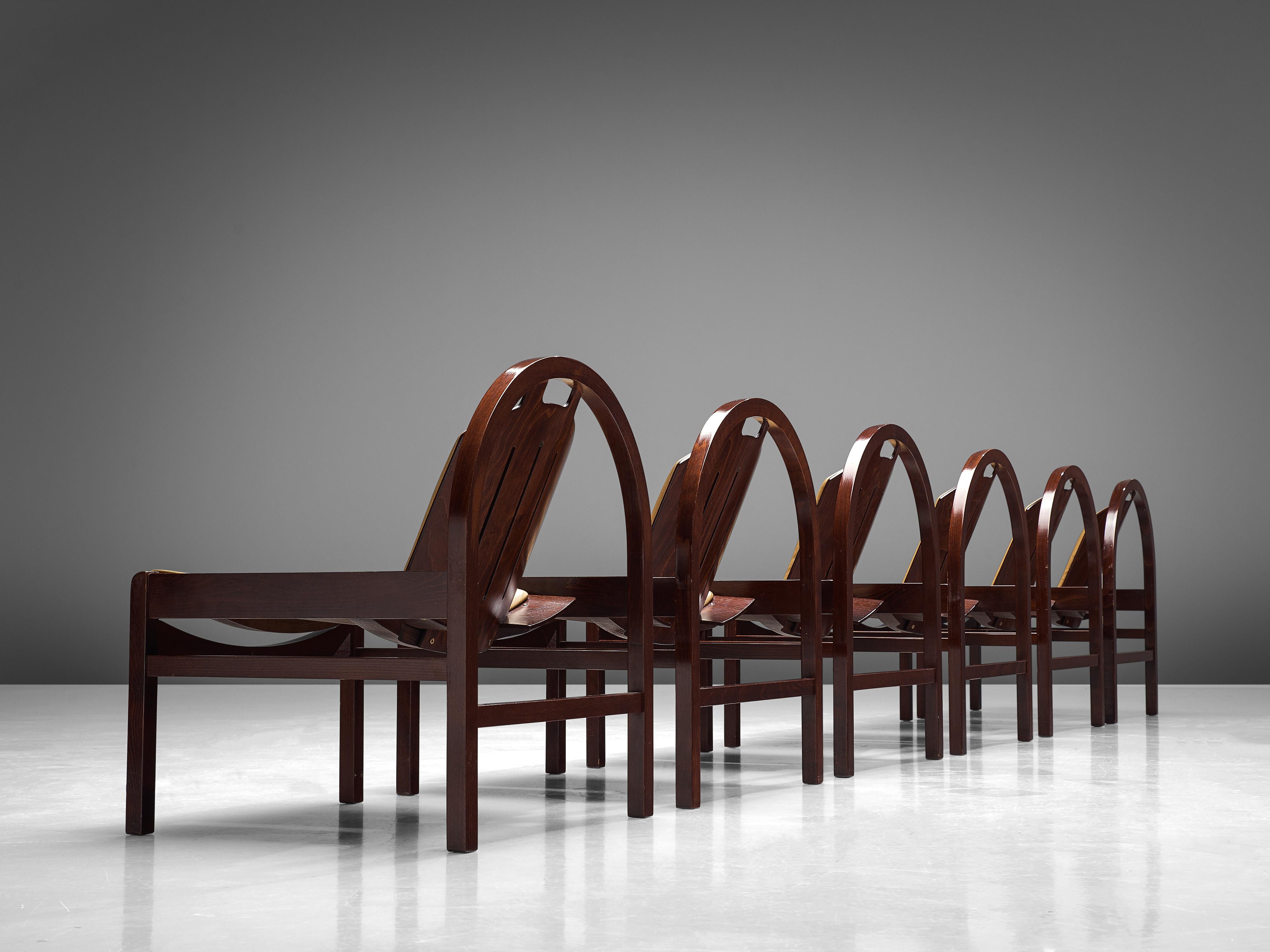 Baumann, 'Argos' easy chairs, stained beech, leather, France, 1970s

These 'Argos' lounge chairs are manufactured by Baumann in France in the 1970s. The chairs feature a round frame that supports the tilted backrest. The seat is wide and low and is