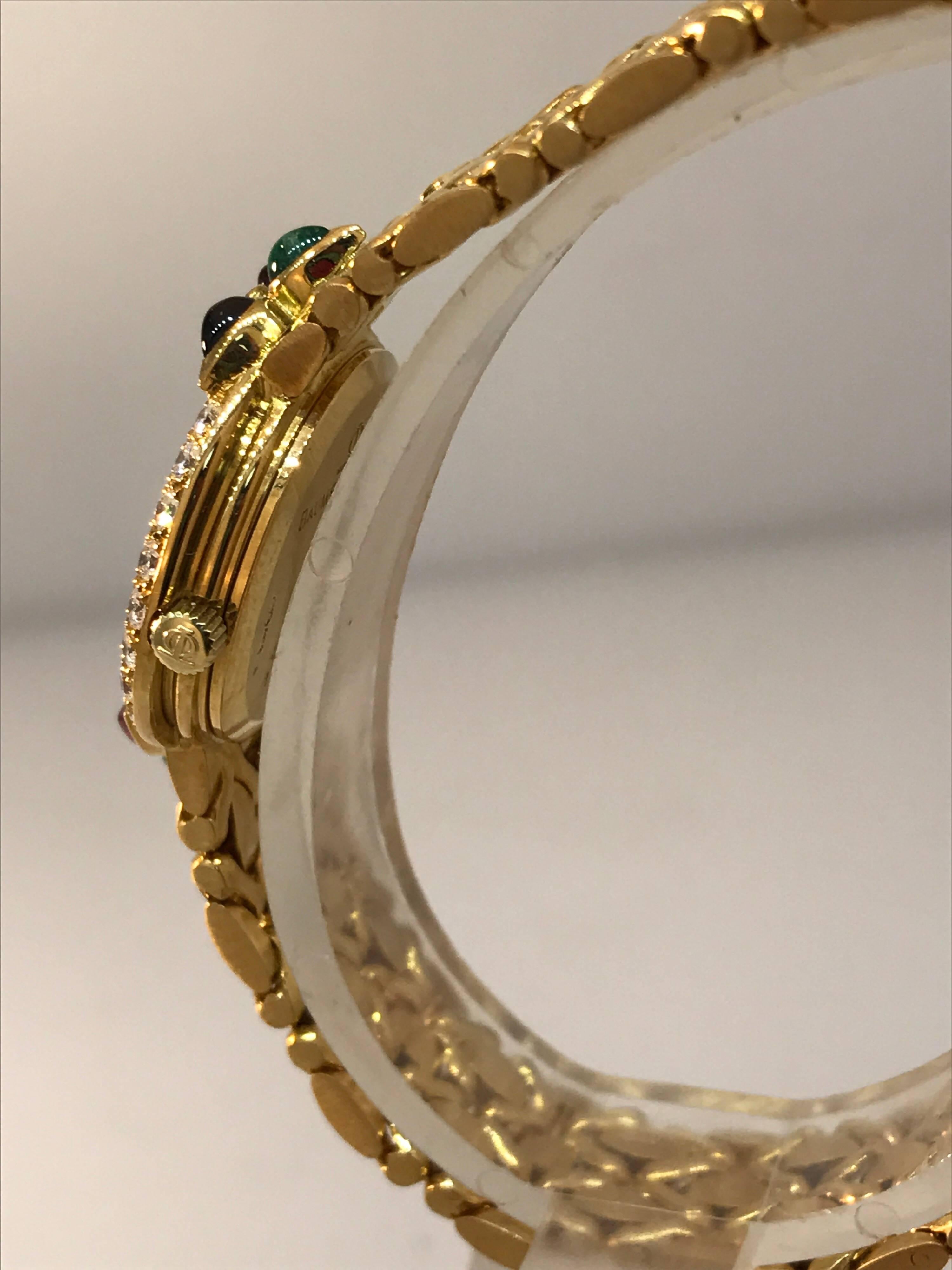 Baume & Mercier 18K Gold Lady's watch with Diamonds, Rubies, Emeralds, Sapphires In Excellent Condition For Sale In New York, NY