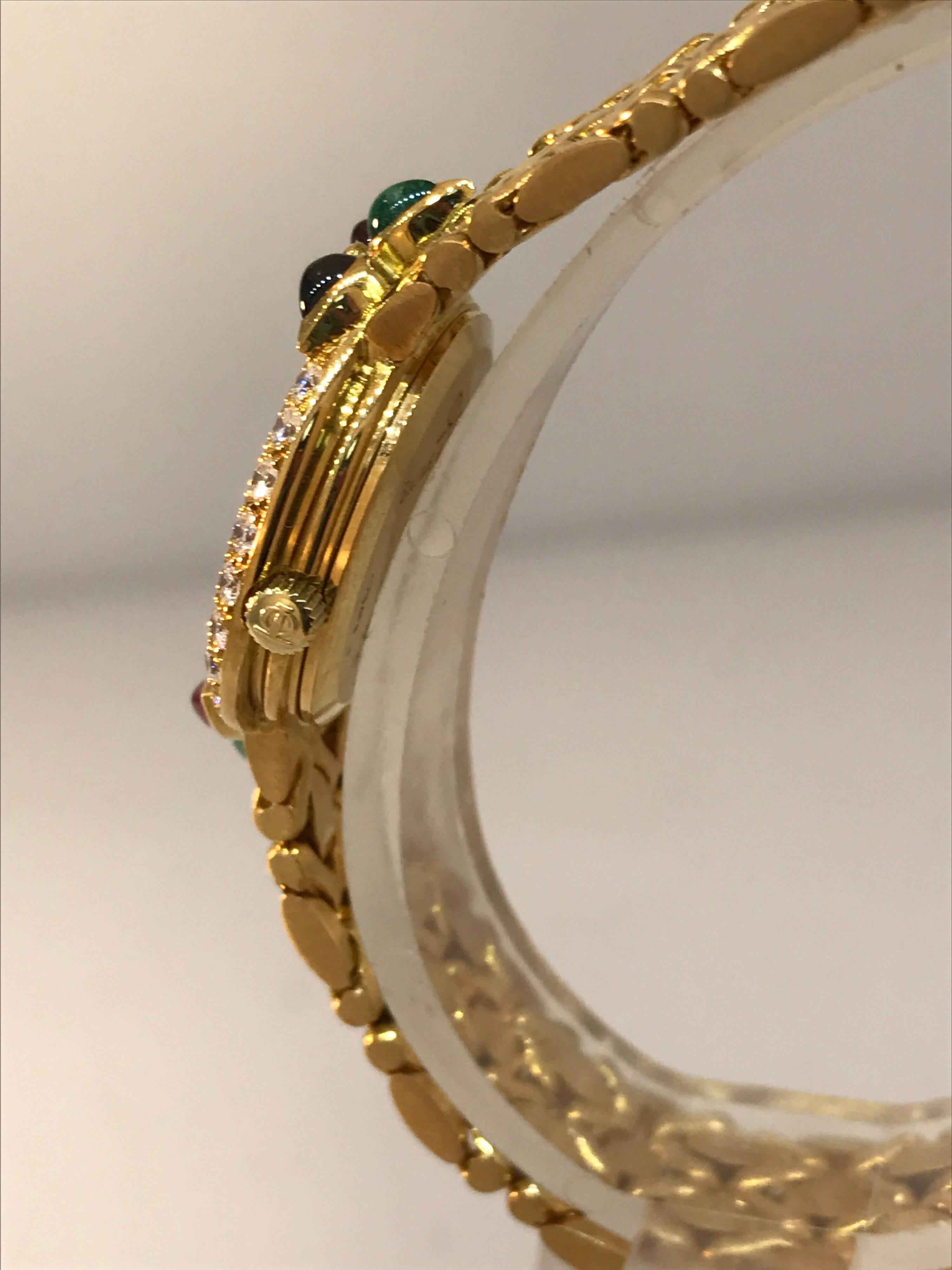 Women's Baume & Mercier 18K Gold Lady's watch with Diamonds, Rubies, Emeralds, Sapphires For Sale