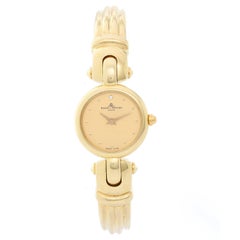 Baume & Mercier Montre-bracelet vintage à quartz en or jaune pour femmes