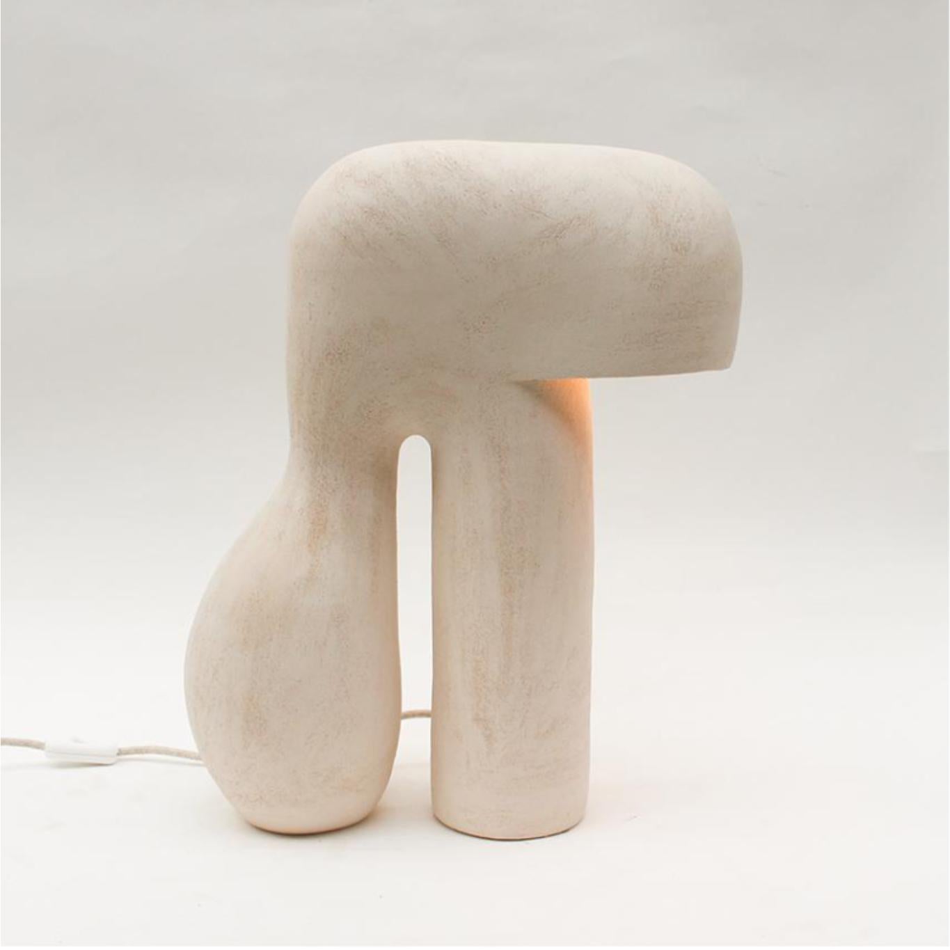 Baume #1 Stoneware lamp by Elisa Uberti
Unique Piece
Dimensions: 15 D x 40 W x H 50 cm
Materials: White Stoneware
This product is handmade, dimensions may vary.

After fifteen years in fashion, Elisa Uberti decides to take the time to work with
