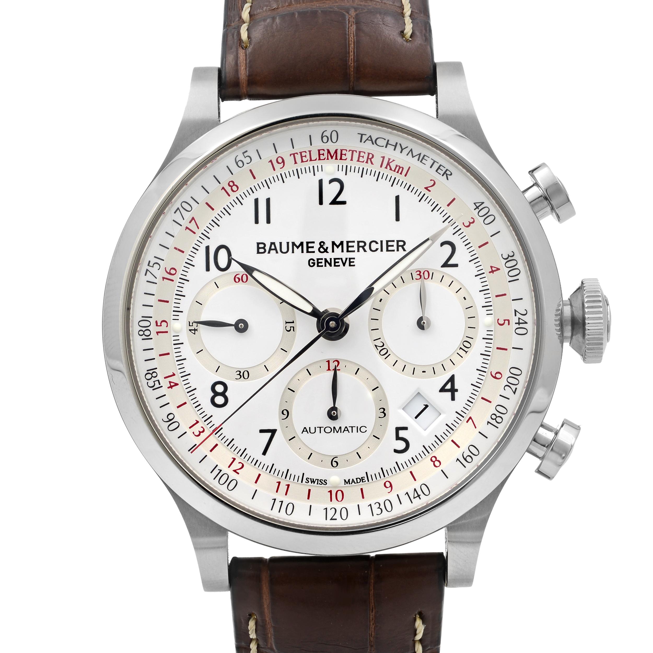 This never been worn  Baume et Mercier Capeland 10082 is a beautiful men's timepiece that is powered by mechanical (automatic) movement which is cased in a stainless steel case. It has a round shape face, chronograph, date indicator, small seconds