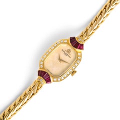Baume Et Mercier Montre-bracelet en or jaune 18 carats avec diamants et rubis