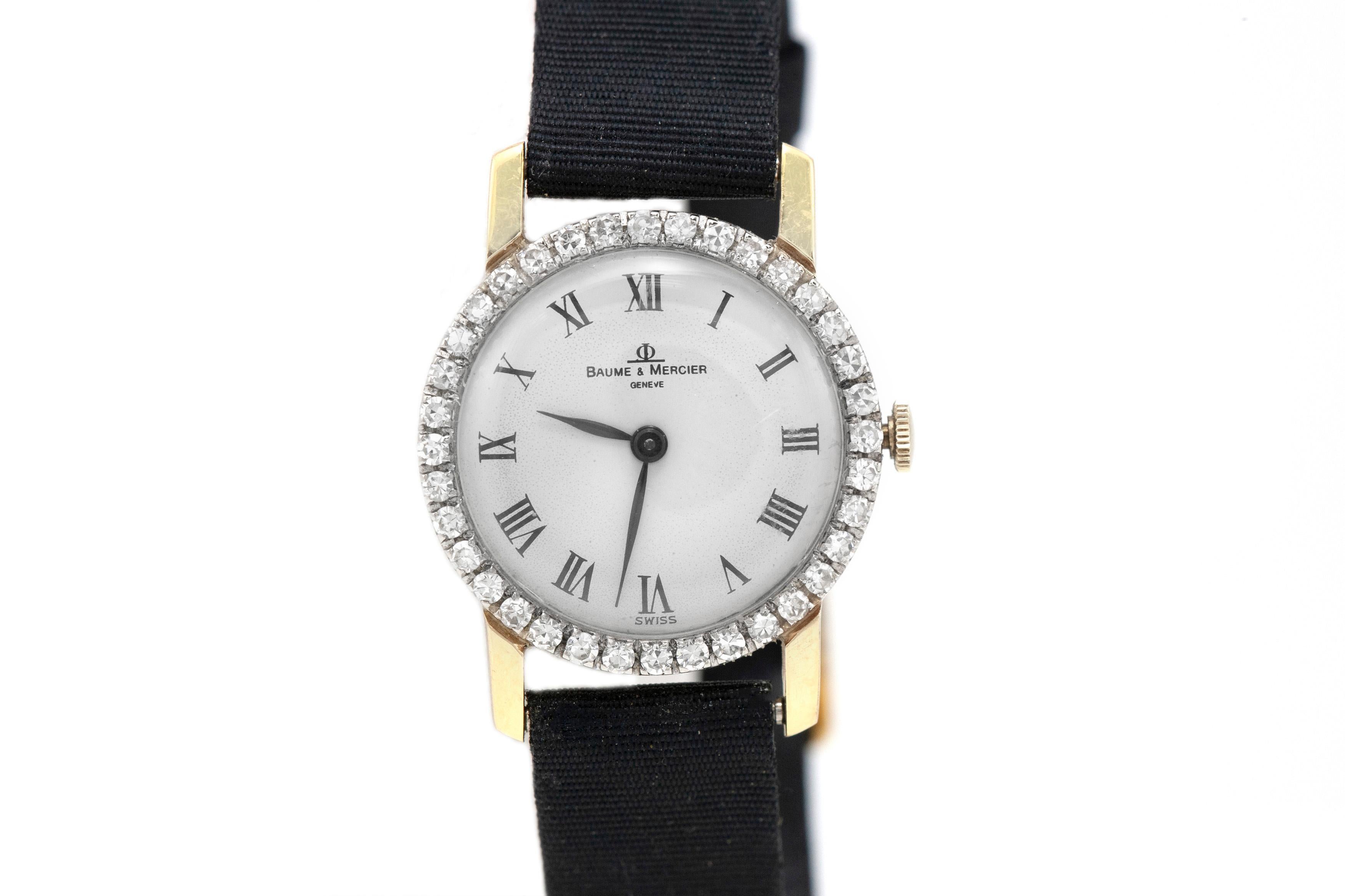 Finely crafted in 18k yellow gold with Round Brilliant cut Diamonds on the bezel weighing approximately a total of 1.20 carats, featuring a fabric band.
The face measures 24mm.
Circa 1950s