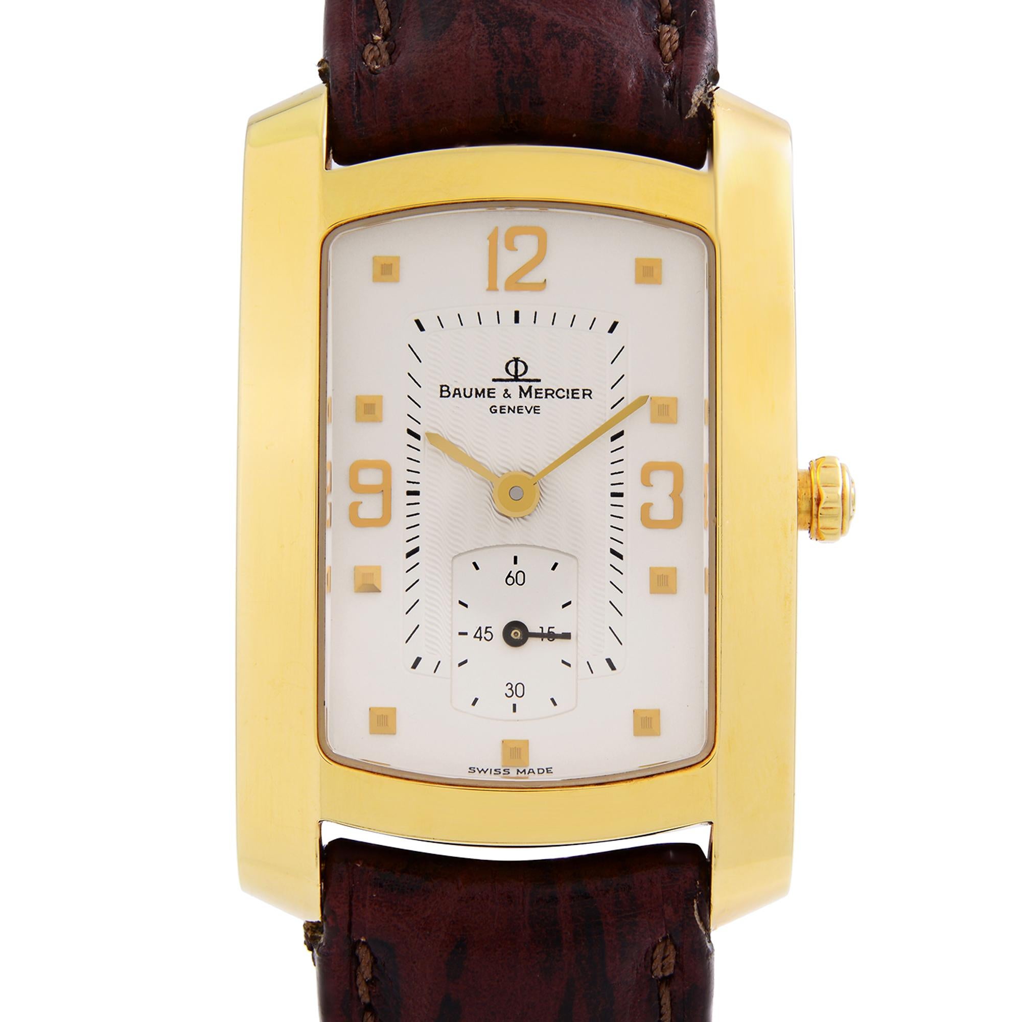 Pre-owned Baume et Mercier Hampton 18K Yellow Gold Quartz Men's Watch. Minor wear signs on a leather band. Original Box and Papers are not included comes with a Chronostore presentation box and authenticity card. Covered by a one-year Chronostore