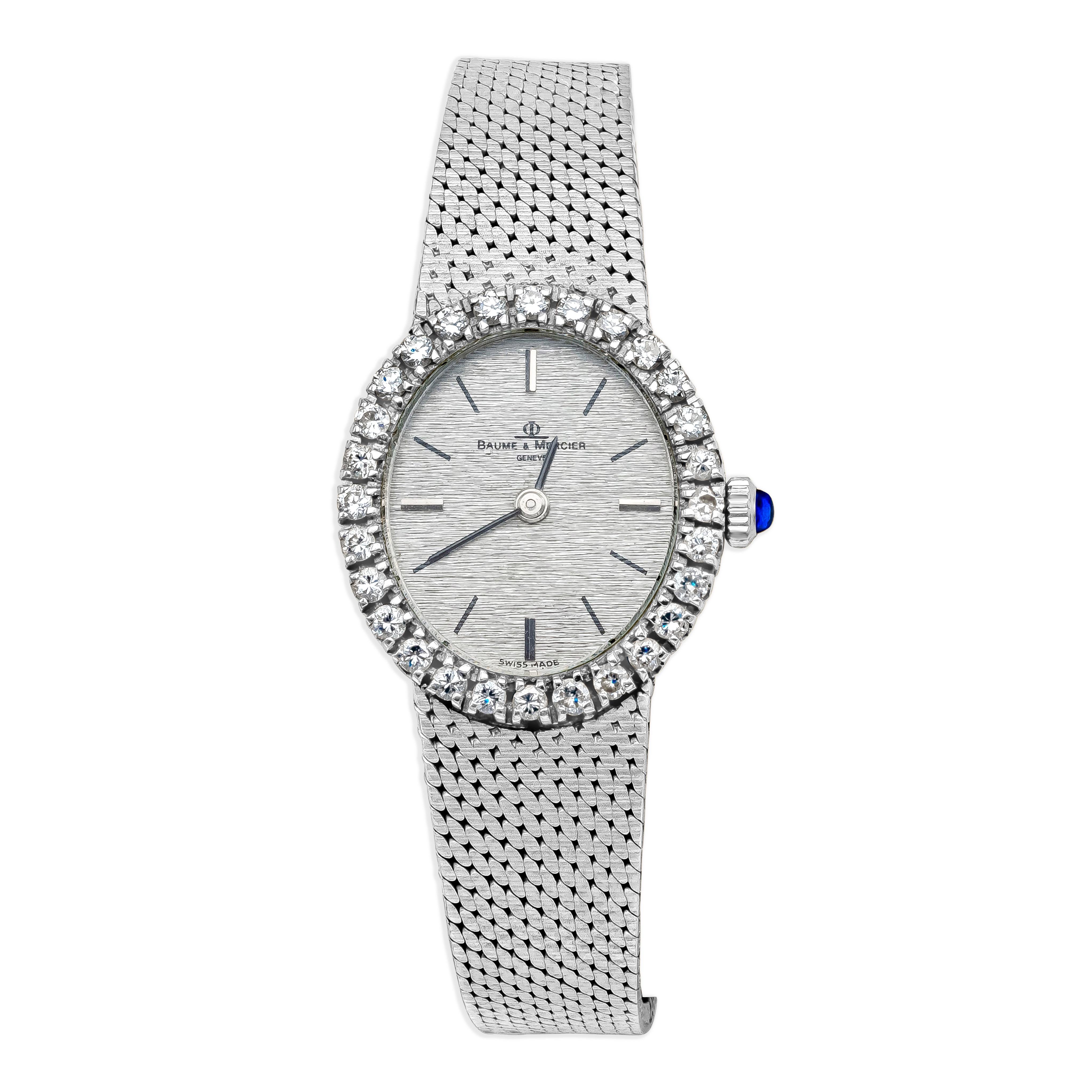 A very beautiful vintage Baume & Mercier ladies cocktail watch in 18k white gold. Decorated with original diamond bezel, with an elegant white gold dial, and a beautiful braided bracelet in white gold. Fine mechanical movement with manual winding,