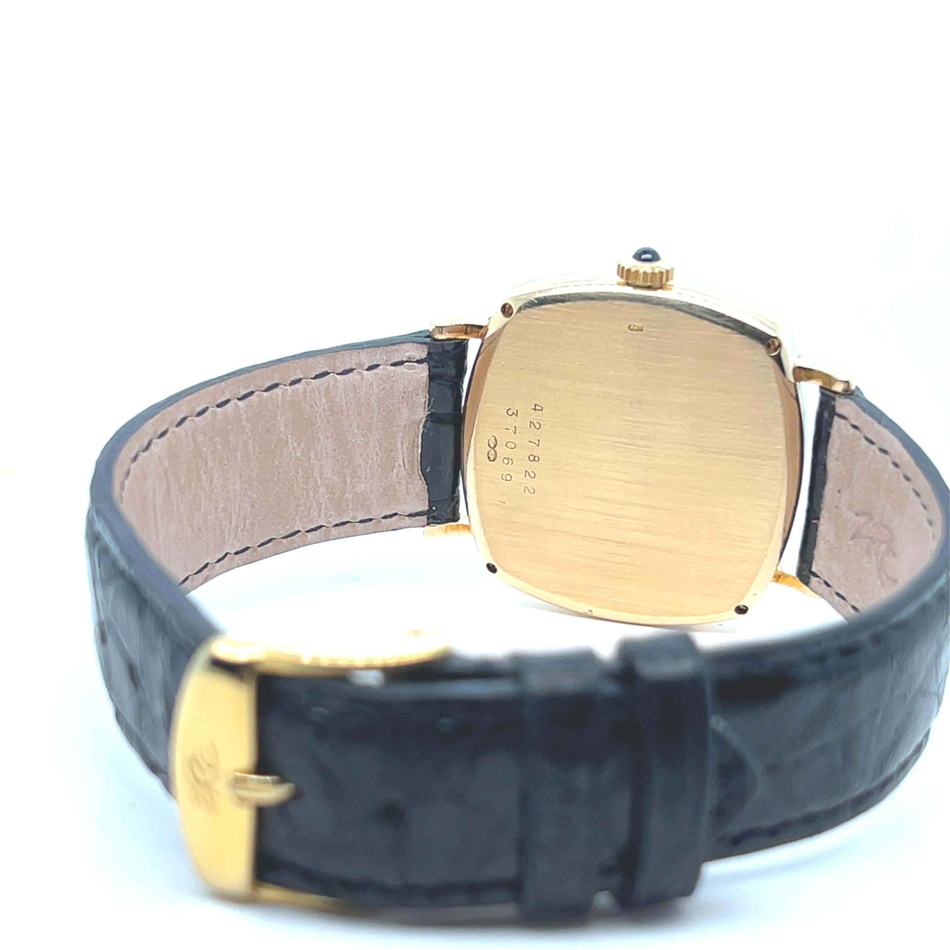 Retro Baume et Mercier Yellow Gold 18 Carats Black Leather Strap Cushion Shape Watch For Sale