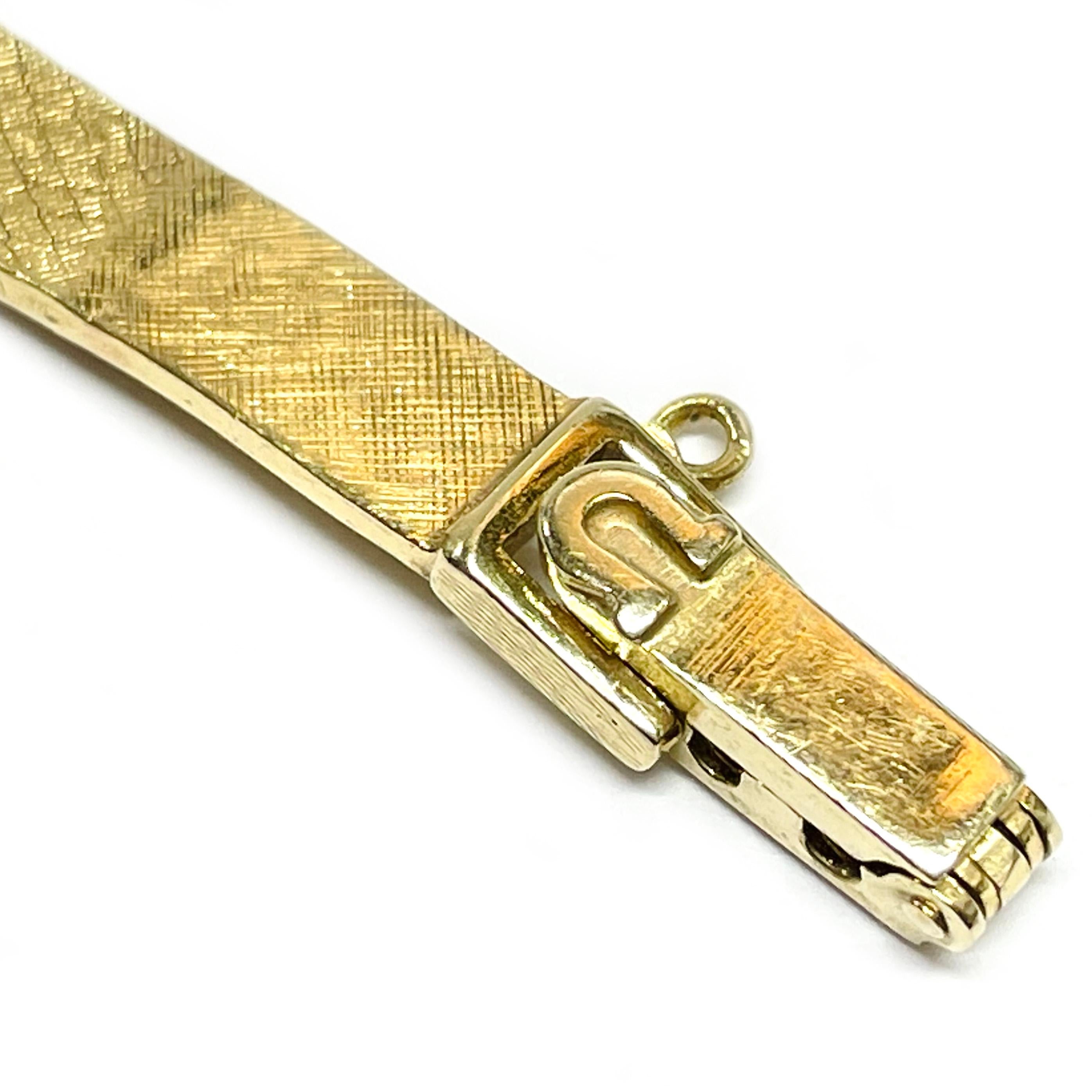 Rétro Montre-bracelet en or jaune de Baume & Mercier en vente