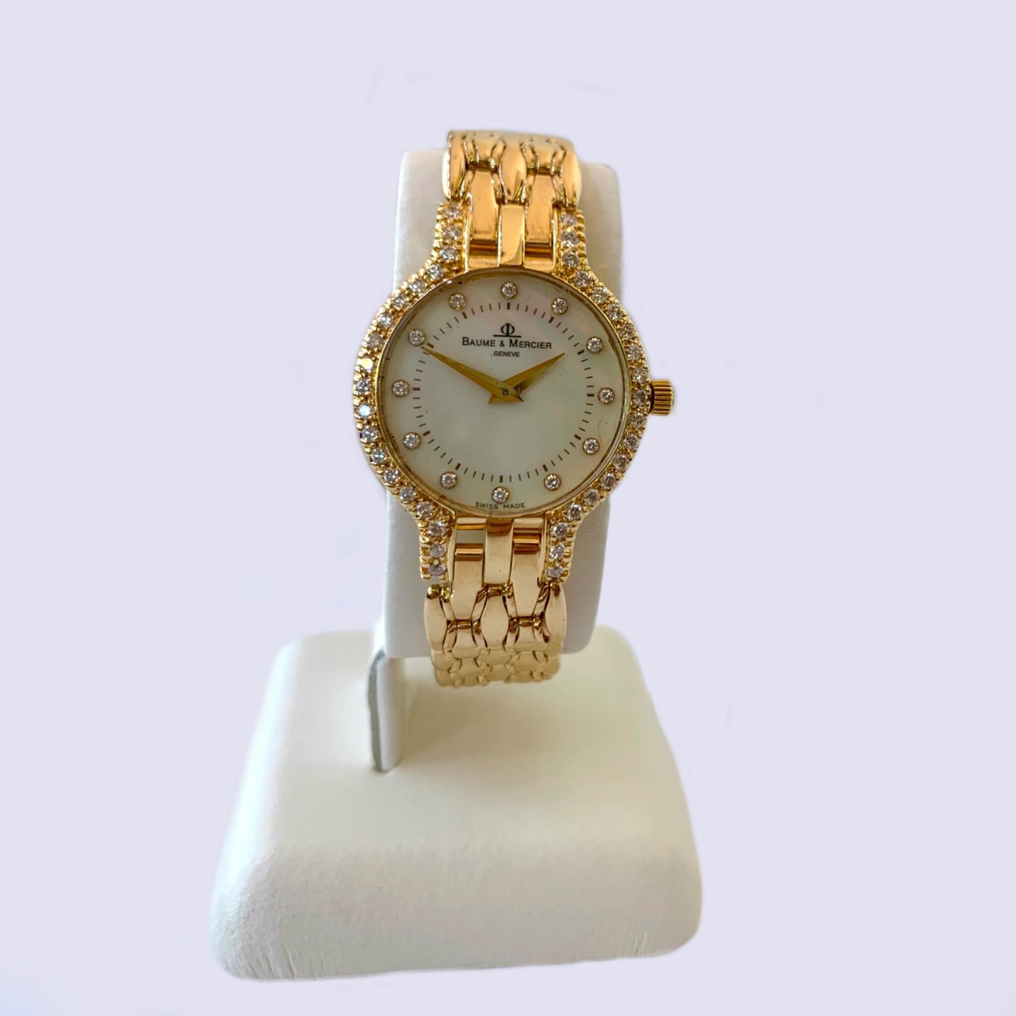 Round Cut Baume & Mercier 14 Karat Yellow Gold, Diamond and Mother of Pearl Watch For Sale