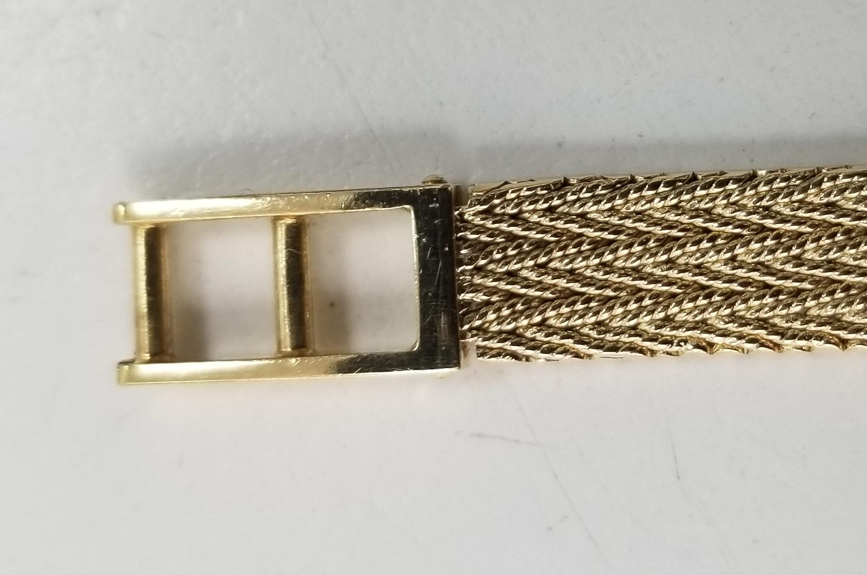 Round Cut Baume & Mercier 14 Karat Yellow Gold and Diamond Watch