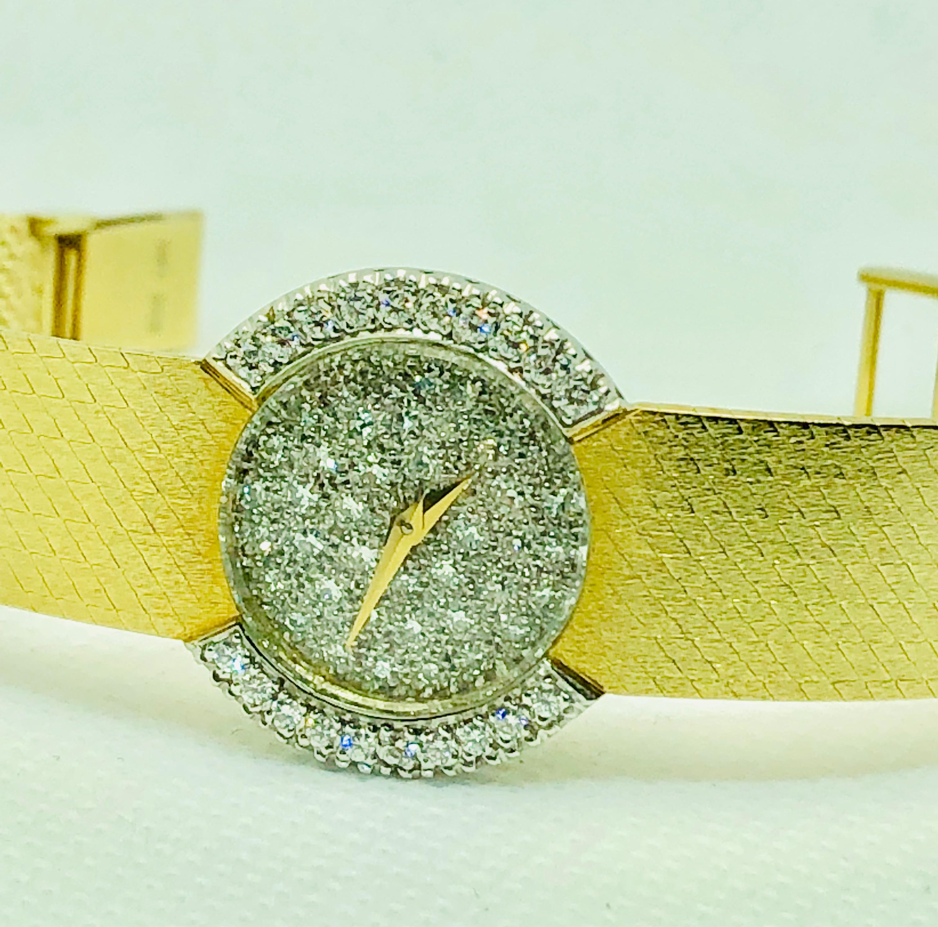 Absolutely Stunning Baume & Mercier Ladies Watch. This vintage piece features 42 single cut diamonds on the dial that are estimated to weigh 0.42 carats. In addition, there are 20 Brilliant Round Cut diamonds on the bezel that are estimated to weigh