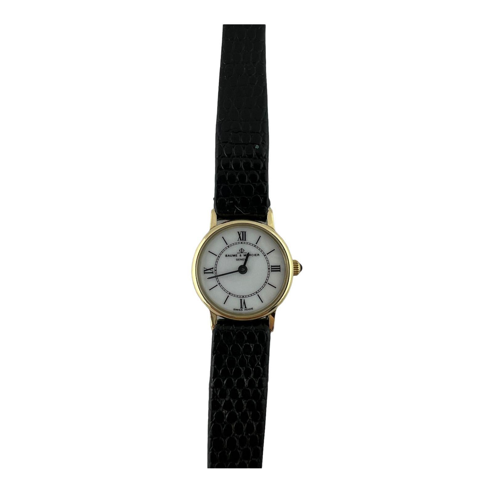 Baume Mercier 14K Yellow Gold Petite Ladies Watch

Quartz movement
 
14K yellow gold case is 18mm in diameter

White Roman and stick dial

Black leather band with gold plated tang buckle - new / not Baume Mercier

approx. 8.25