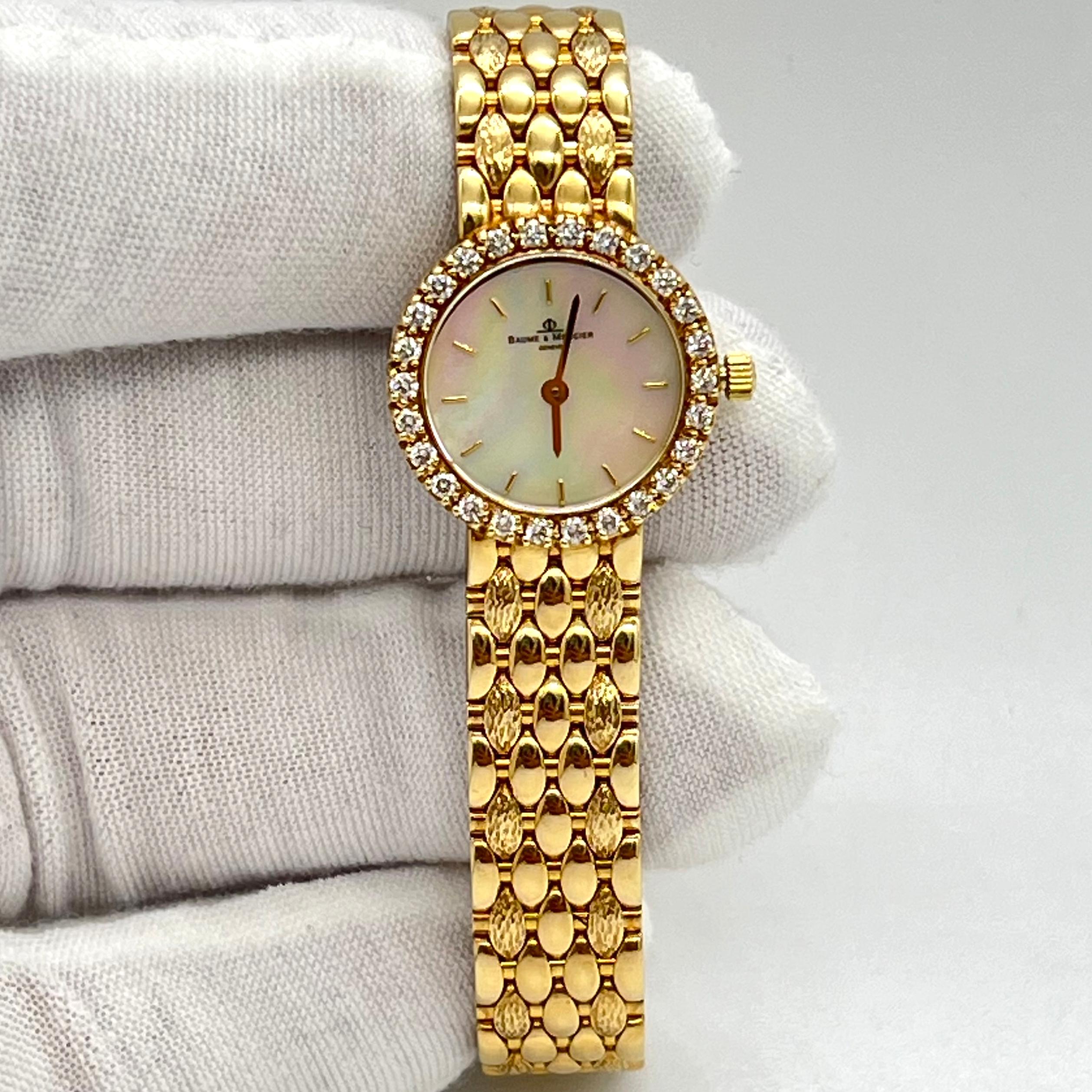 BAUME & MERCIER 14k Yellow Gold round case Watch with a genuine diamond bezel 0.90cts approximation, this item is pure 14kt yellow gold and is on very good condition quartz watch ( battery ) 

Condition
Pre-owned


Bezel Color:              