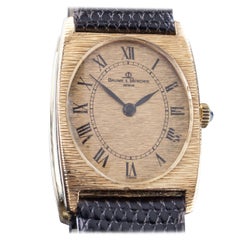 Used Baume & Mercier 18 Karat Gold Tonneau Hand-Winding Watch with Black Leather Band