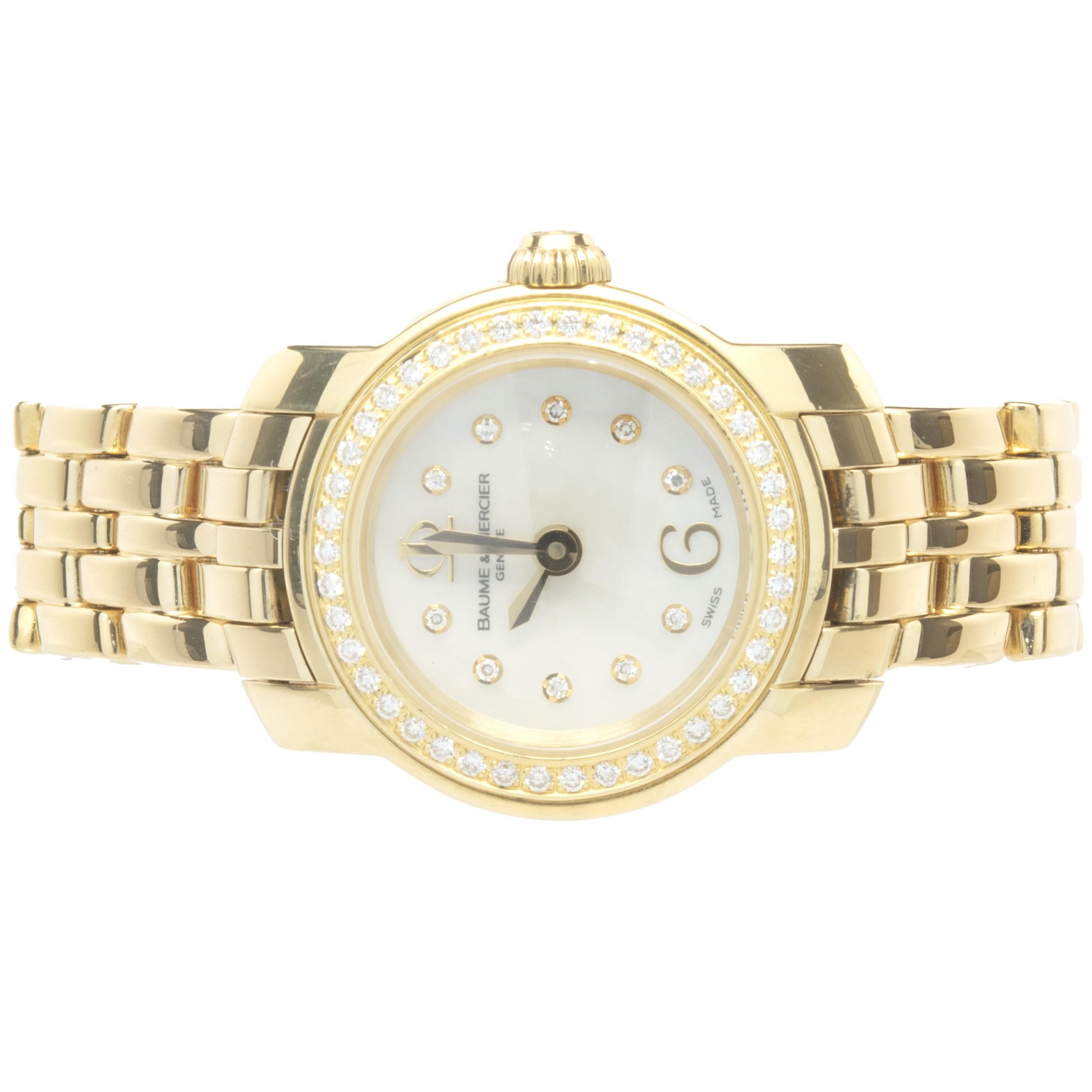 Movement: quartz
Function: hours, minutes
Case: 22mm round case, diamond bezel, push/pull crown
Band: 18K yellow gold bracelet, integrated clasp
Dial: diamond mother of pearl

Complete with original box and papers
Guaranteed to be authentic by