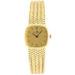 Baume & Mercier Montre-bracelet vintage en or jaune 18 carats et maille, pour femmes