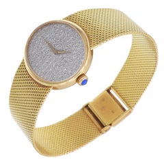 Baume & Mercier 18K yellow gold and diamond wristwatch.