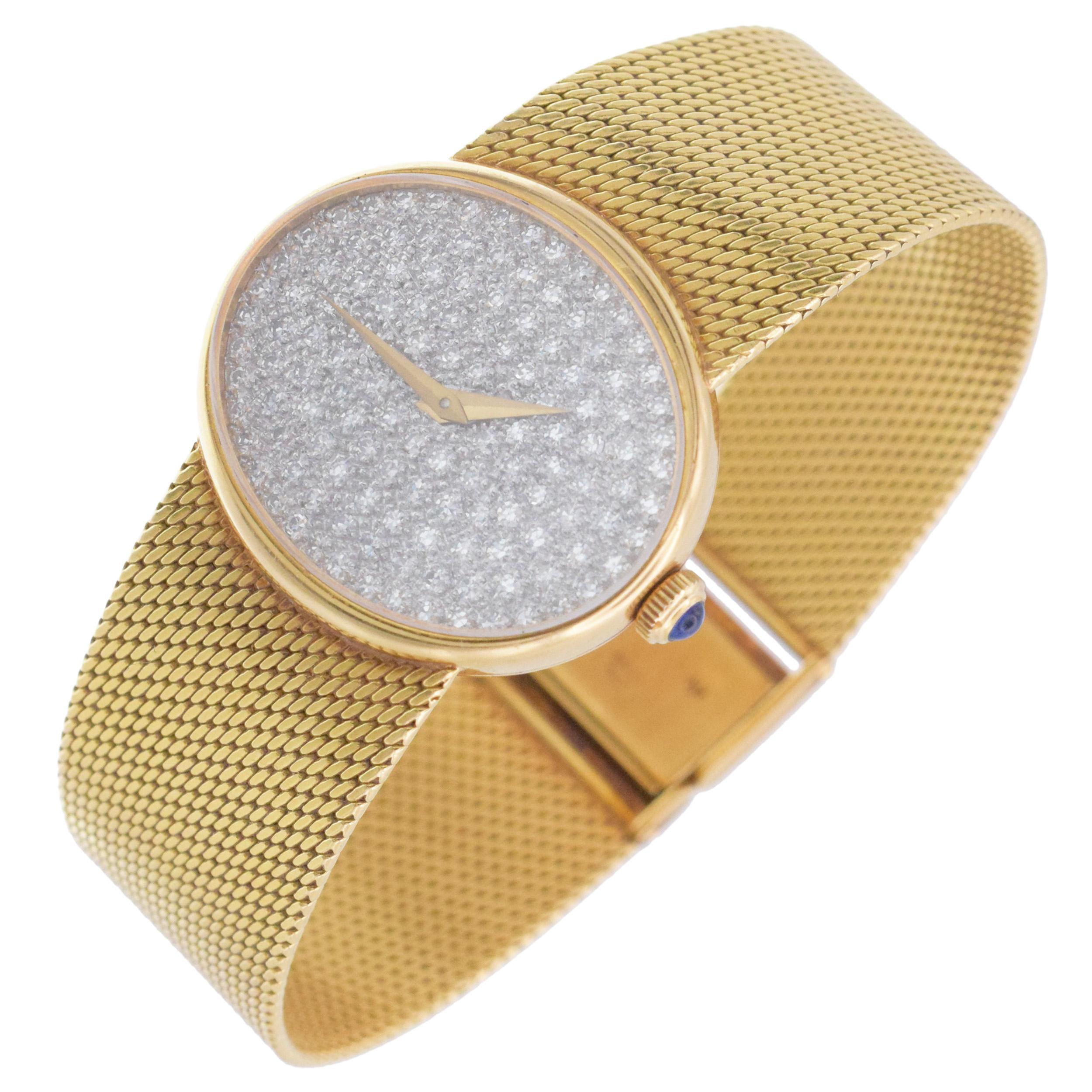 Femenino o masculino Reloj de pulsera Baume & Mercier de oro amarillo de 18 quilates y diamantes. en venta