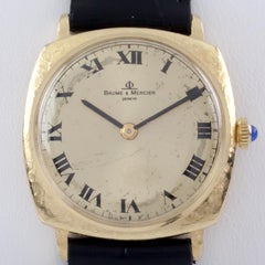Montre pour homme Baume et Mercier en or 18 carats avec coussin et bracelet en cuir noir