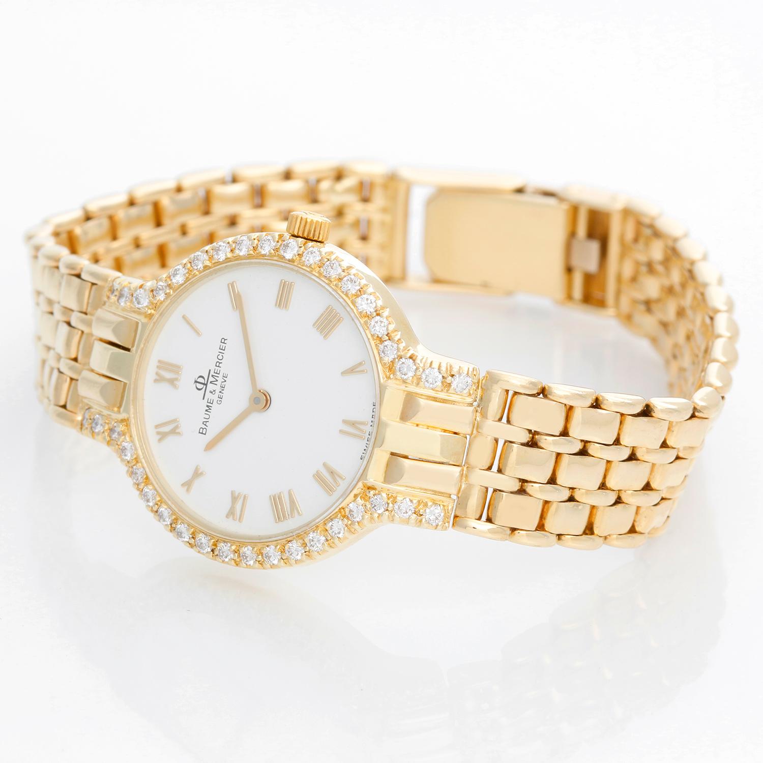 Baume & Mercier 18K Yellow Gold Diamond Watch - Quartz . 18K Yellow gold with diamonds on bezel and lugs ( 24 mm ) . White dial with raised gold Roman numerals . 18K Yellow gold link bracelet . Pre-owned with custom box .