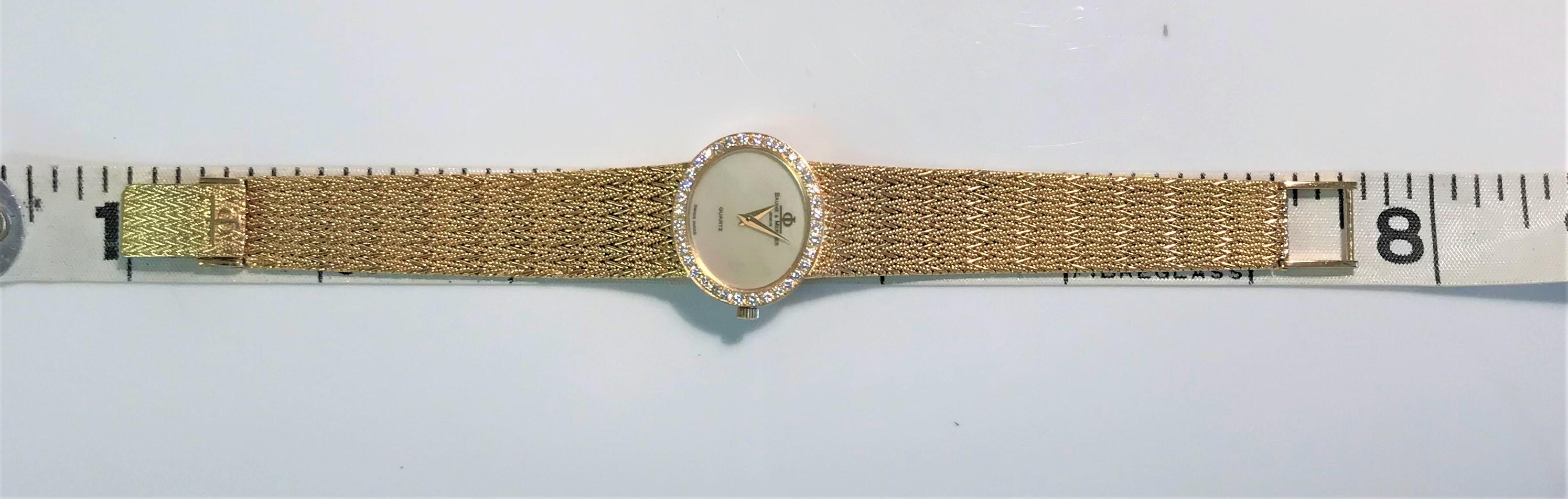 baume and mercier gold watch with diamonds