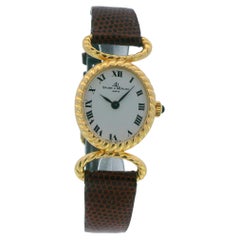 Baume & Mercier Montre pour femme à boîtier cannelé en or jaune 18 carats