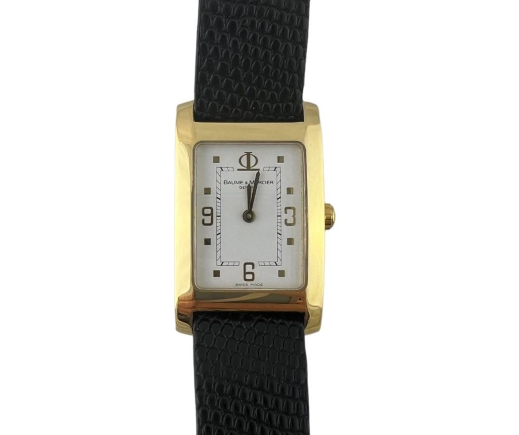 Baume & Mercier 18K Yellow Gold Hampton Watch

Model: 65479
Serial: 4400456

Quartz movement

18K yellow gold case is 25mm x 32mm

White dial with gold markers

Black leather original Baume Mercier band with original tang buckle some slight wear to