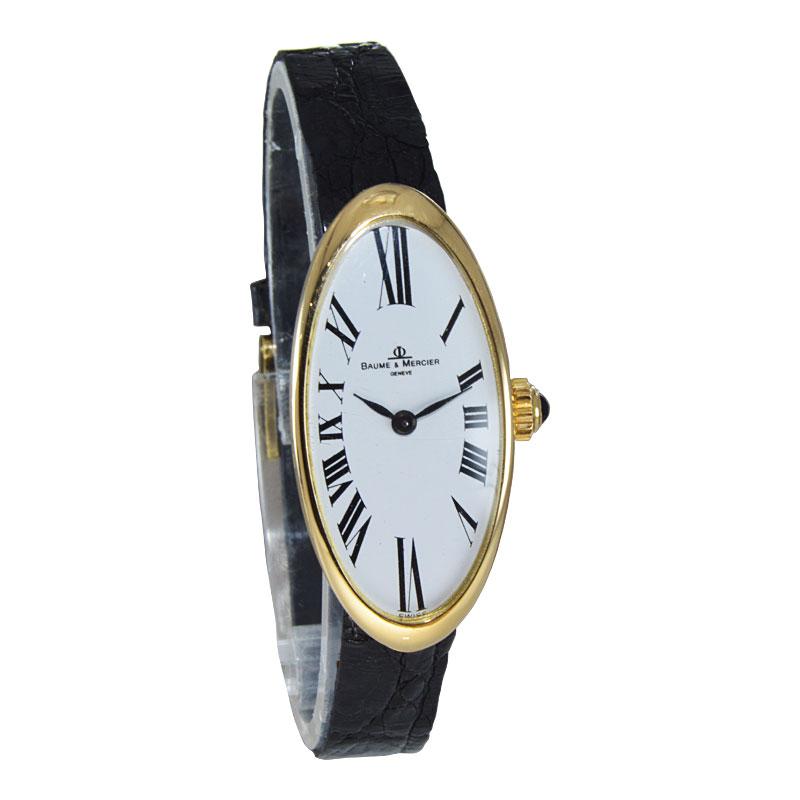 FACTORY / HOUSE: Baume & Mercier Watch Company
STYLE / REFERENCE: Exaggerated Oval
METAL / MATERIAL: 18Kt yellow Gold
CIRCA / YEAR: 1970's
DIMENSIONS / SIZE: 37mm X 17mm
MOVEMENT / CALIBER: Manual Winding / 17 Jewels 
DIAL / HANDS: Original White