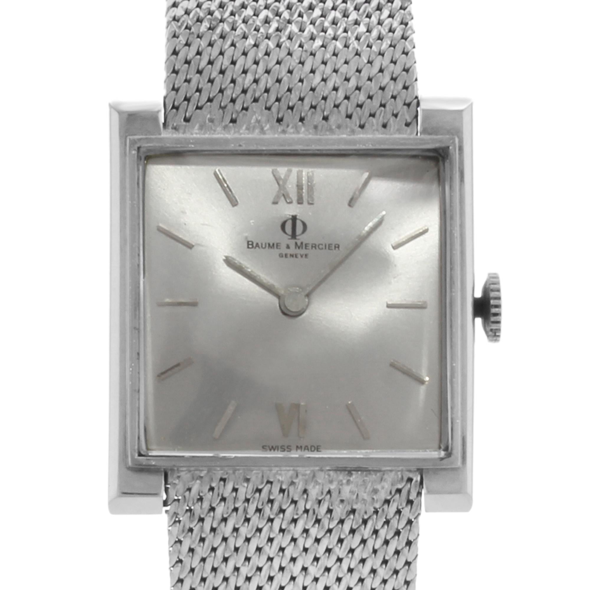 This pre-owned Baume et Mercier Geneve is a beautiful Ladies timepiece that is powered by a mechanical movement which is cased in a stainless steel case. It has a square shape face, no features dial, and has hand sticks style markers. It is